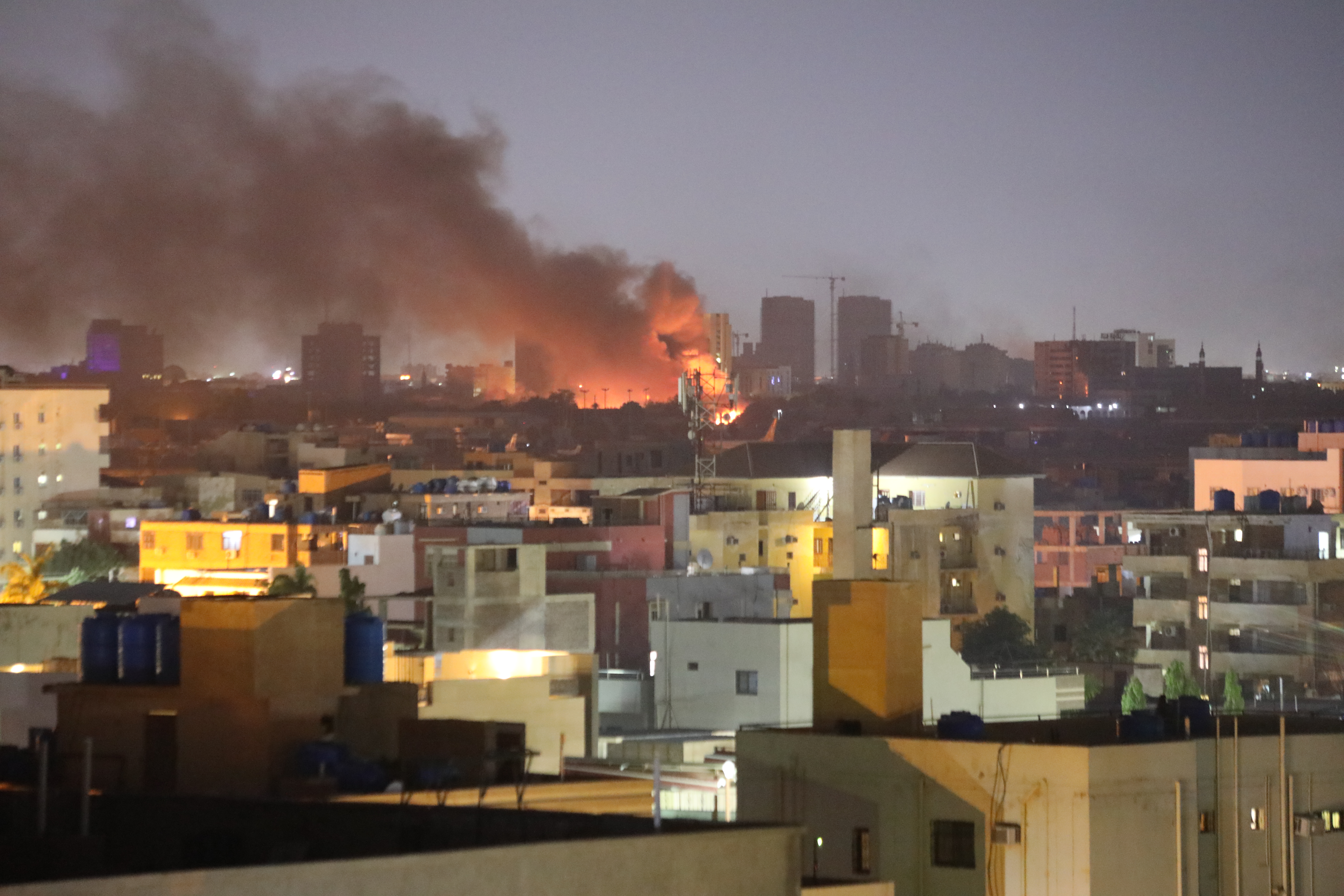 Fighting between the Sudanese army and the RSF send smoke rising over Khartoum on April 16, 2023