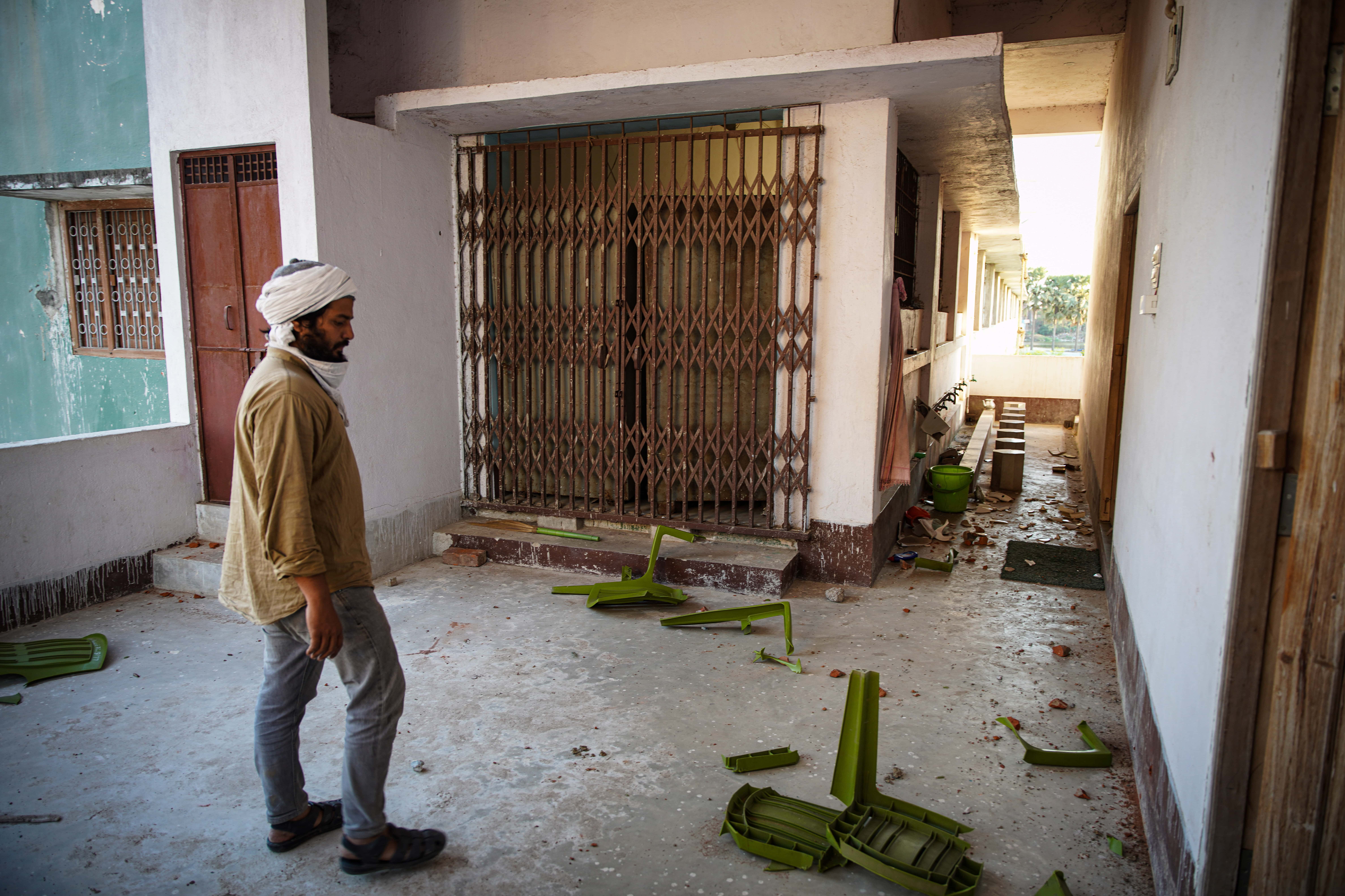 A man looks at the broken chair inside a mosque in Nalanda Bihar