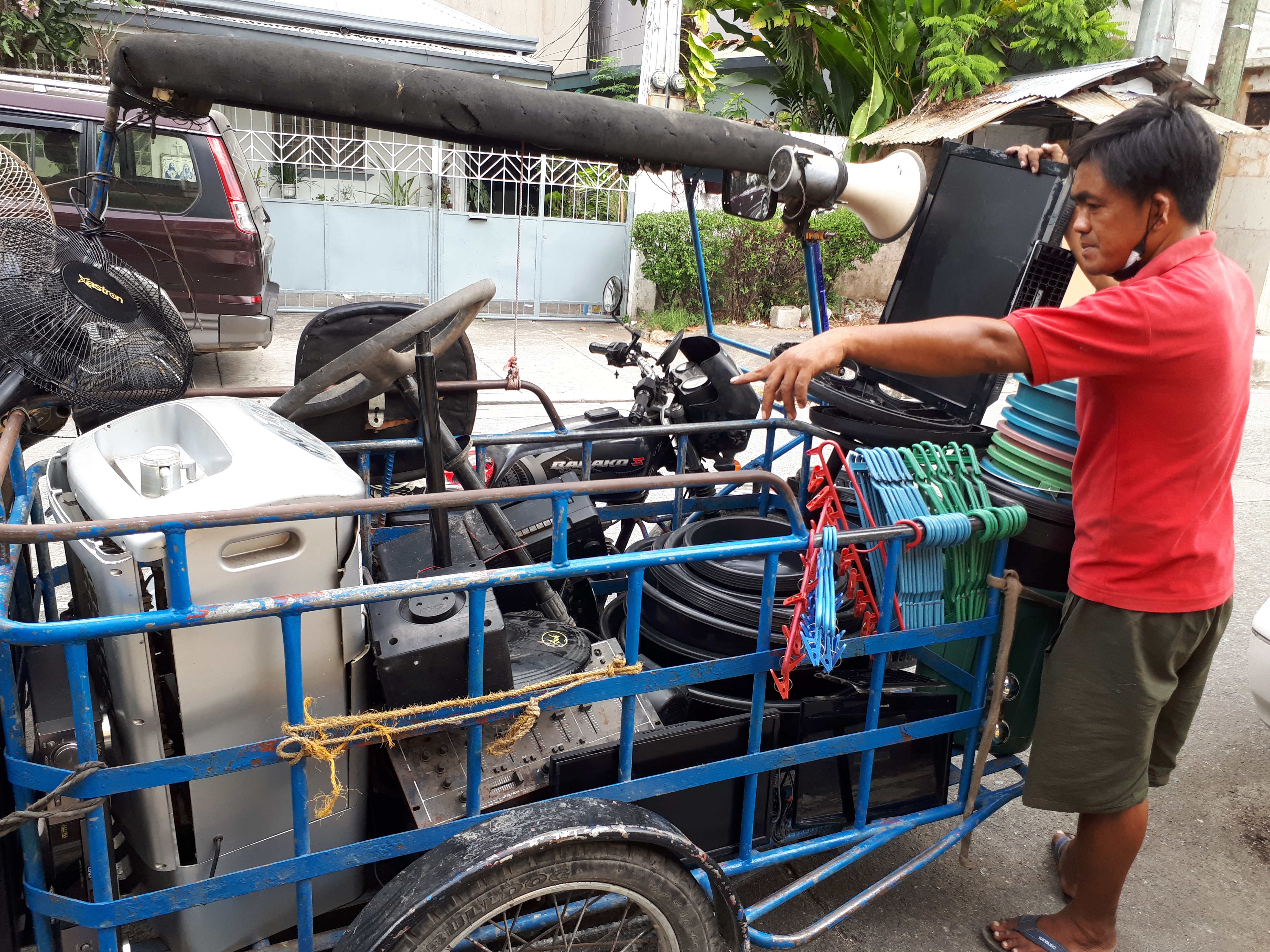 Alfredo Barrun Pineda swapped his taxi for a motorcycle to cut down on petrol costs [Raissa Robles]