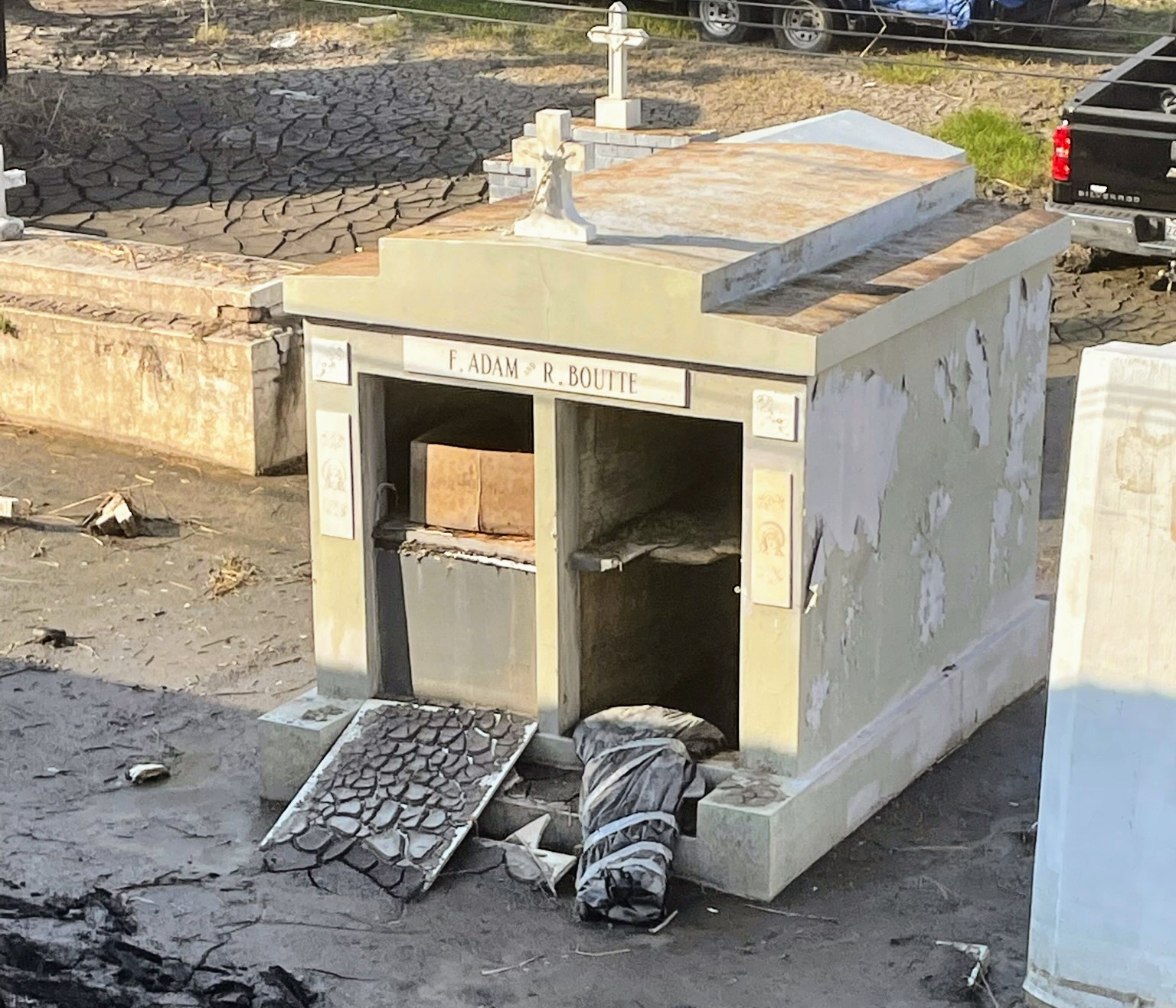 In Lafitte, 2021’s Hurricane Ida displaced hundreds of burials. Kristen Tauzin, a resident, says for months following the storm, she had this view from her window, of plastic-wrapped remains displaced from a damaged vault [Courtesy of Kristen Tauzin]