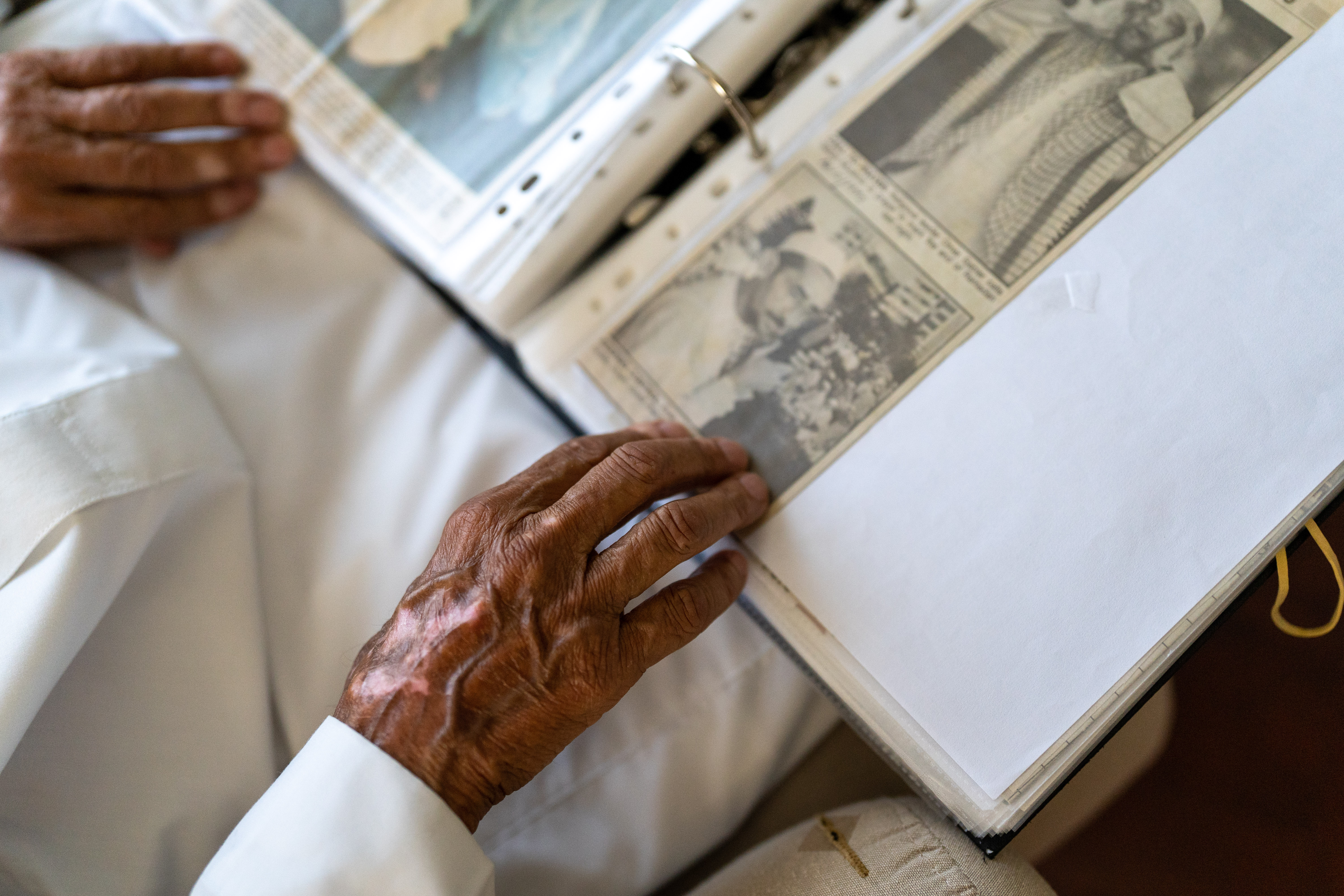 Imam Pandy pages through a file of newspaper clippings pertaining to the moon sightings collected over a few decades