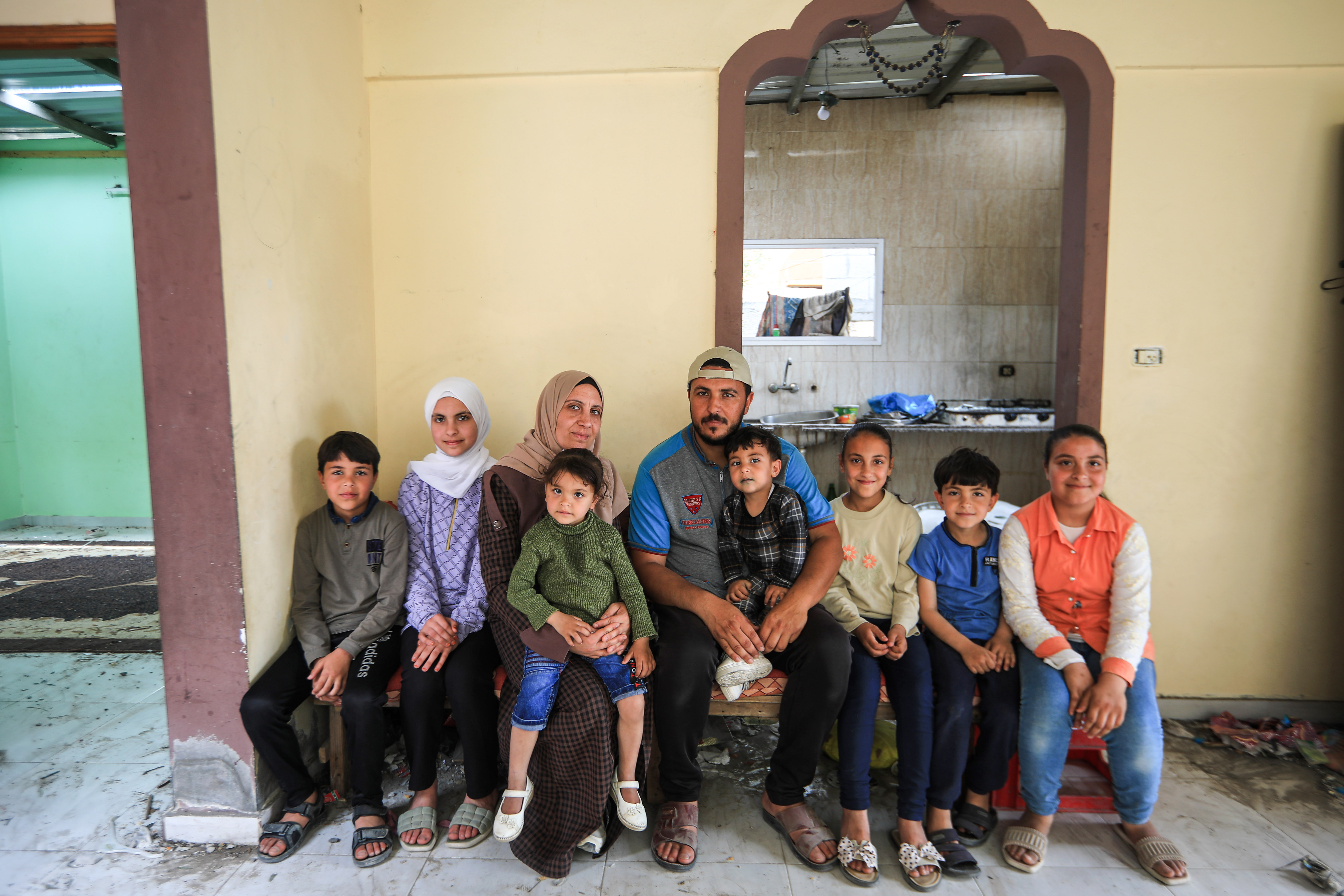 Aisha, her husband, and their seven children
