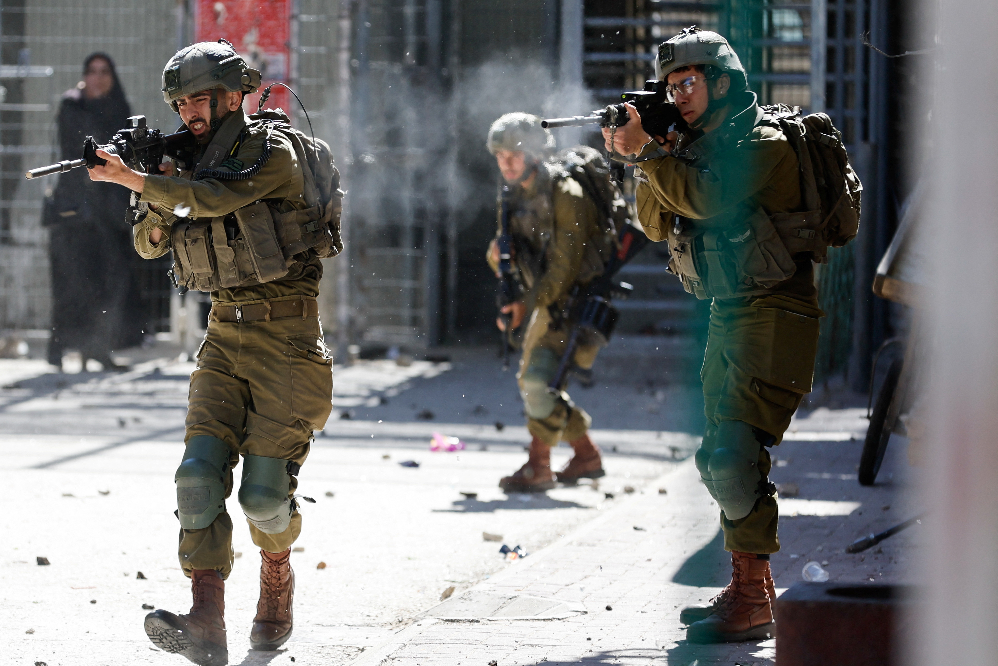 Israeli soldiers shoot rubber bullets at Palestinians during clashes following the death of Palestinian prisoner Khader Adnan during a hunger strike in an Israeli jail, in Hebron in the Israeli-occupied West Bank May 2,2023.