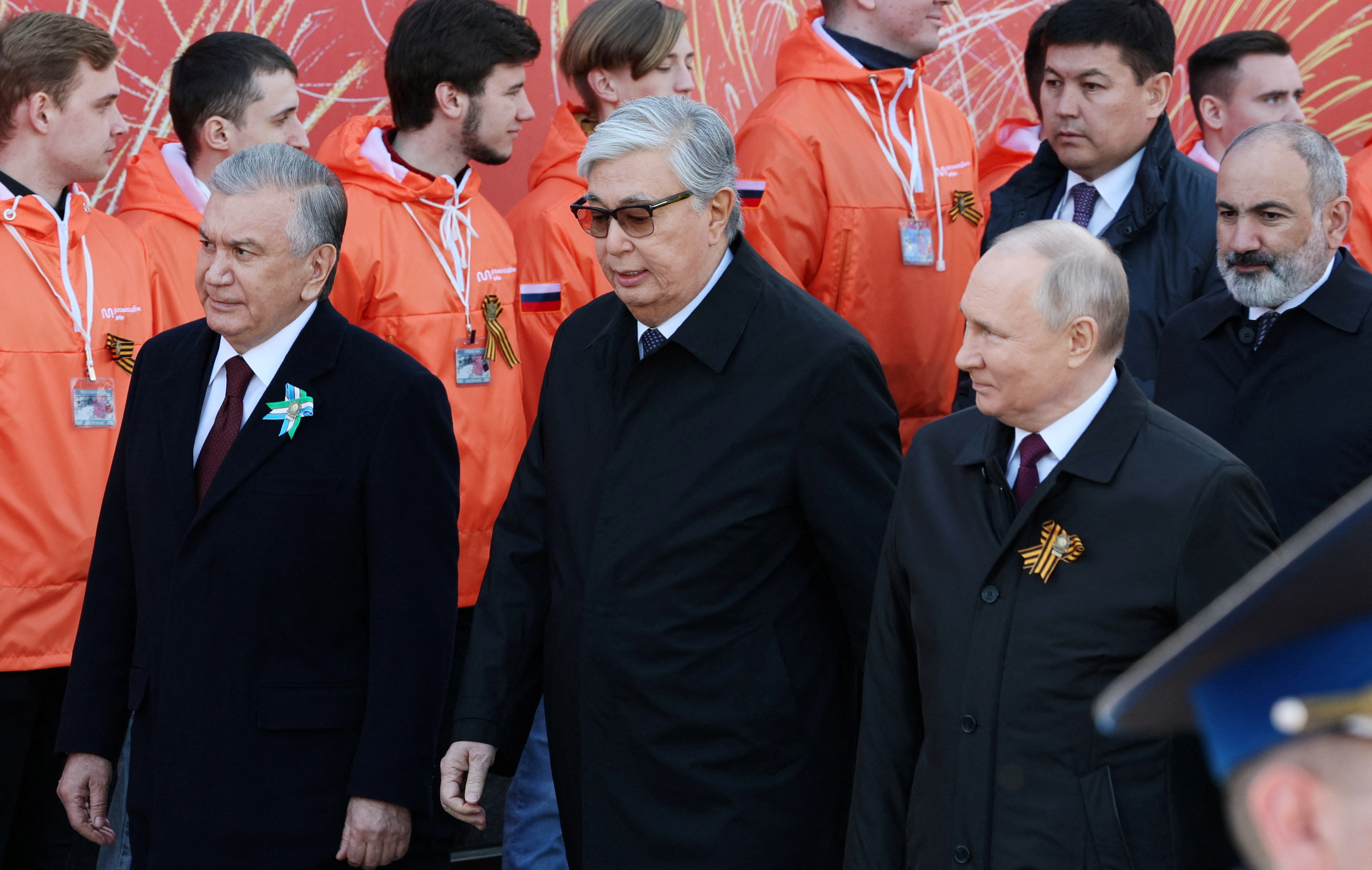 From right, Russian President Vladimir Putin, Kazakh President Kassym-Jomart Tokayev and Uzbek President Shavkat Mirziyoyev attend a military parade on Victory Day in Red Square