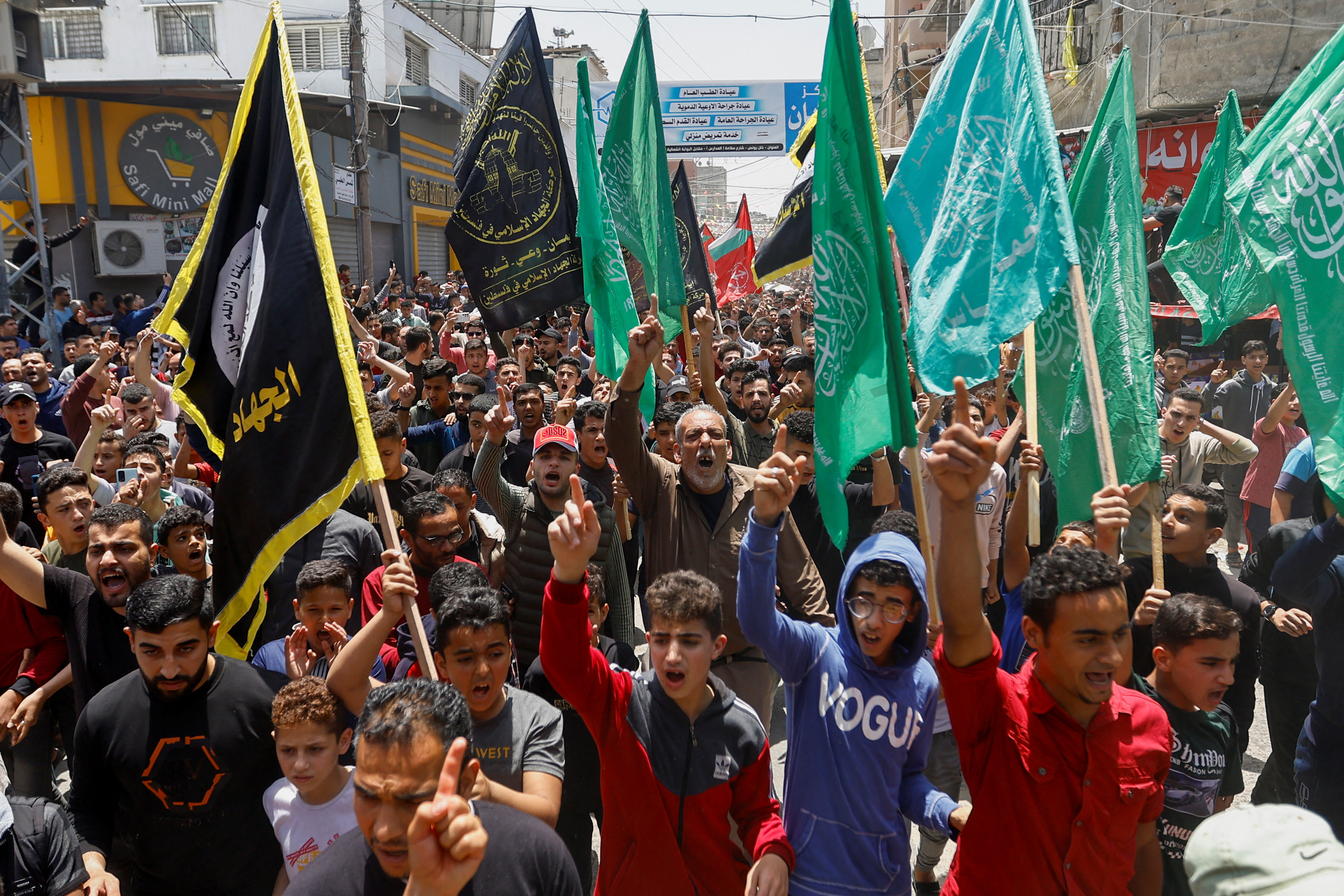 Mourners attend the funeral of Islamic Jihad commander Ali Ghali and his brother Mahmoud who were killed in an Israeli strike, in Khan Younis in the southern Gaza Strip