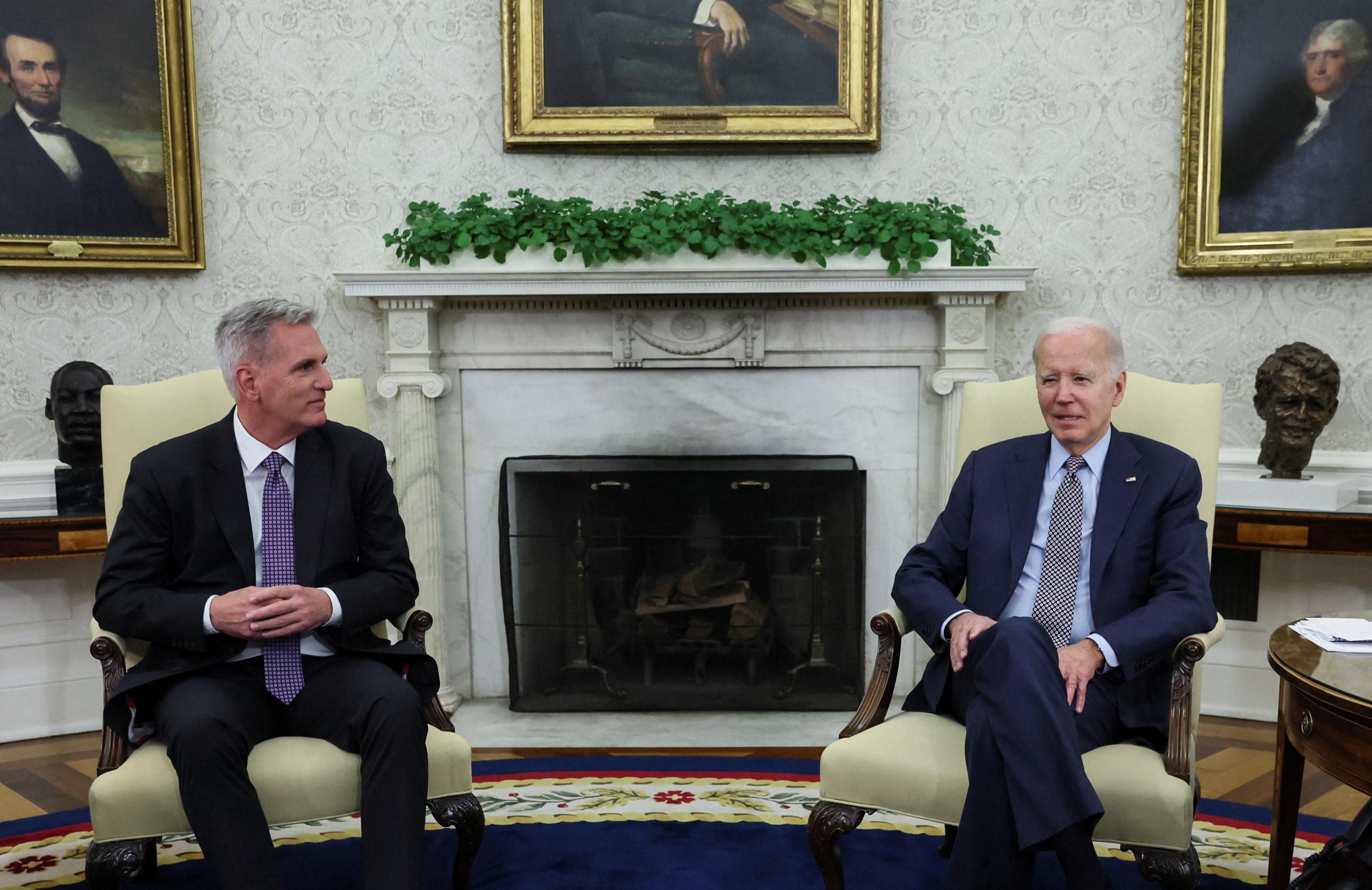 US President Joe Biden and Republican House Speaker Kevin McCarthy are seen together in the Oval Office for debt-ceiling talks on May 22