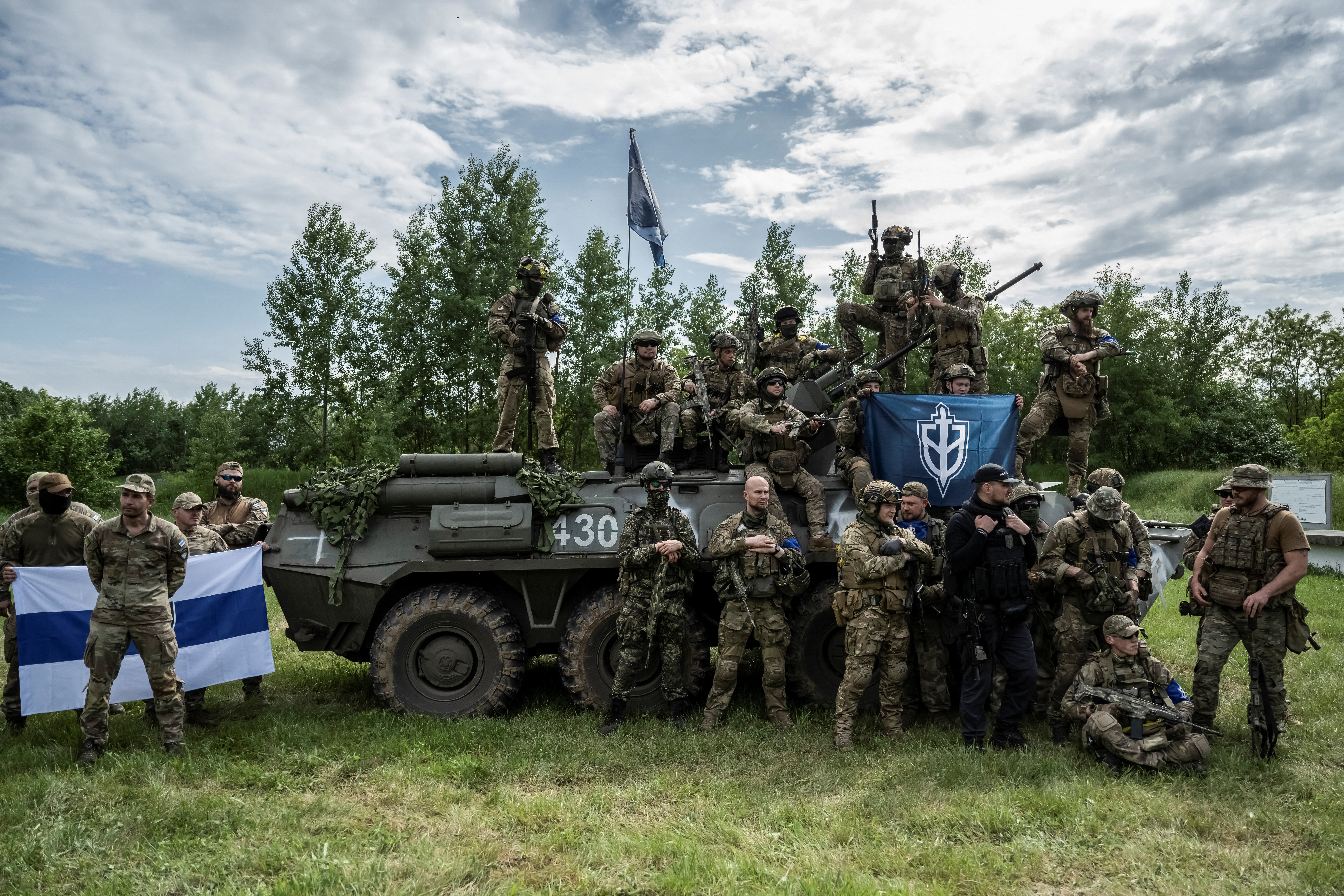 Members of the Russian Volunteer Corps with an armoured fighting vehicle near the Russian border in Ukraine on May 24, 2023