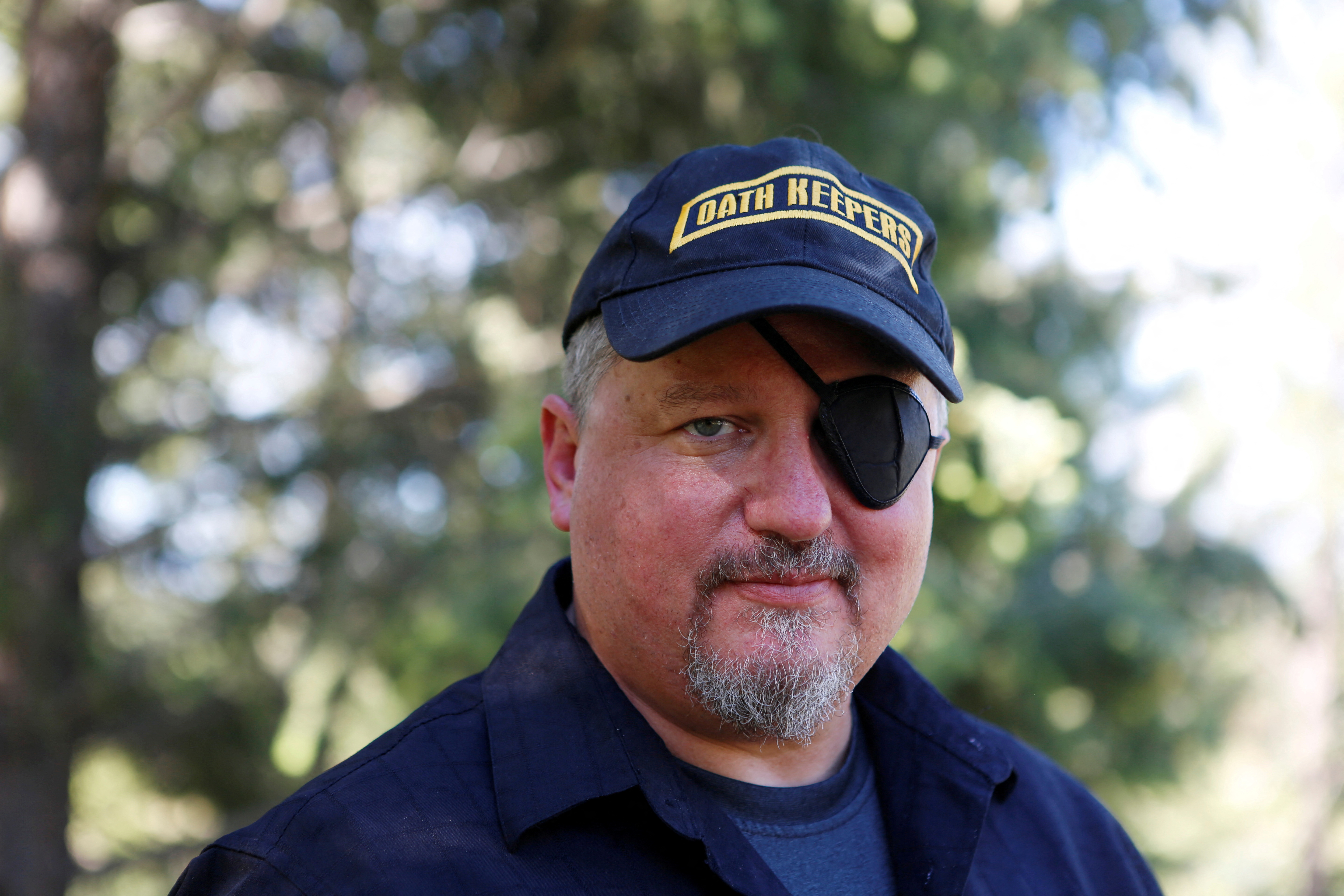 A man with an eye patch in an outdoor setting
