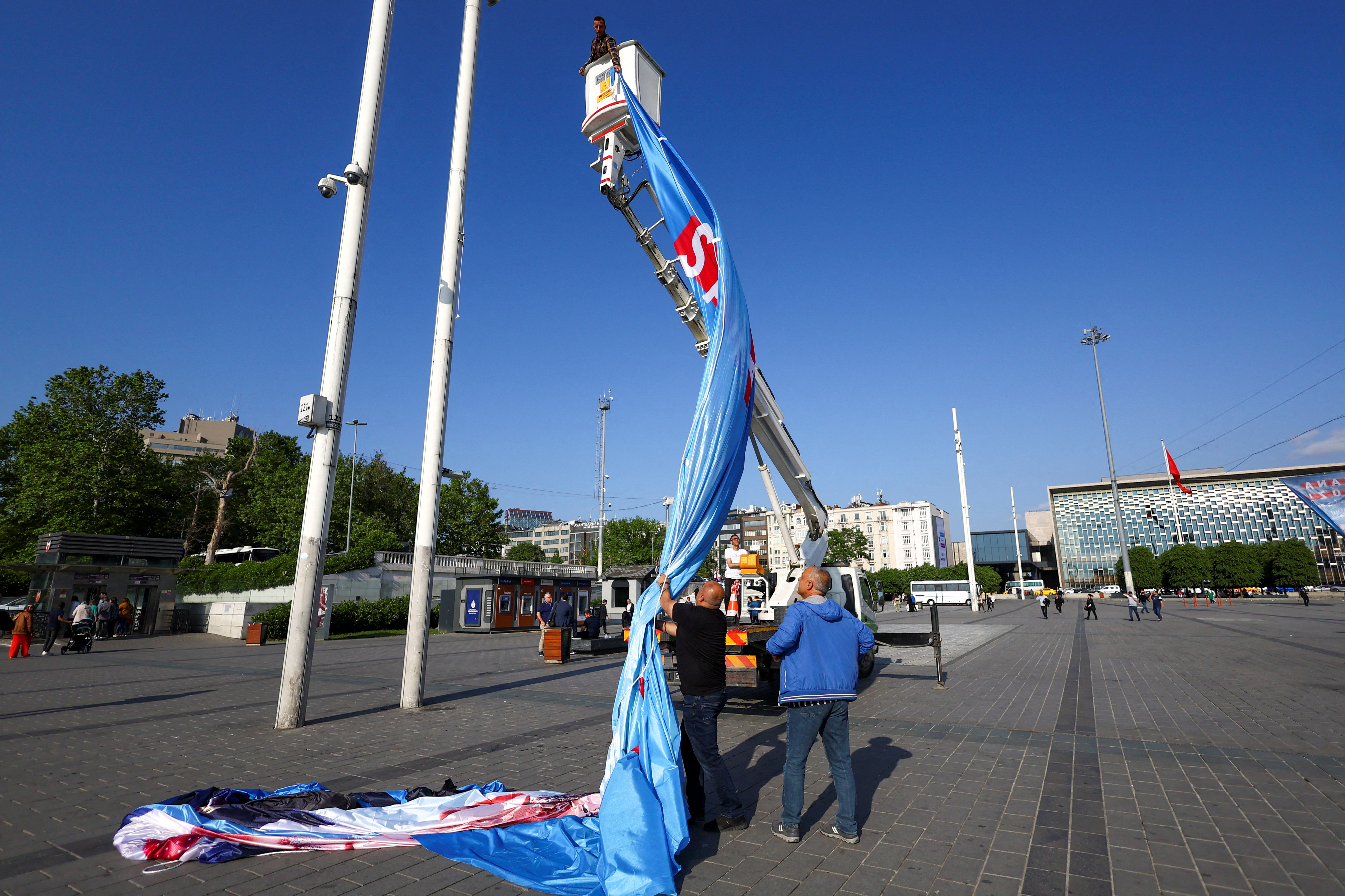 Election banners are removed from Istanbul’s Taksim Square