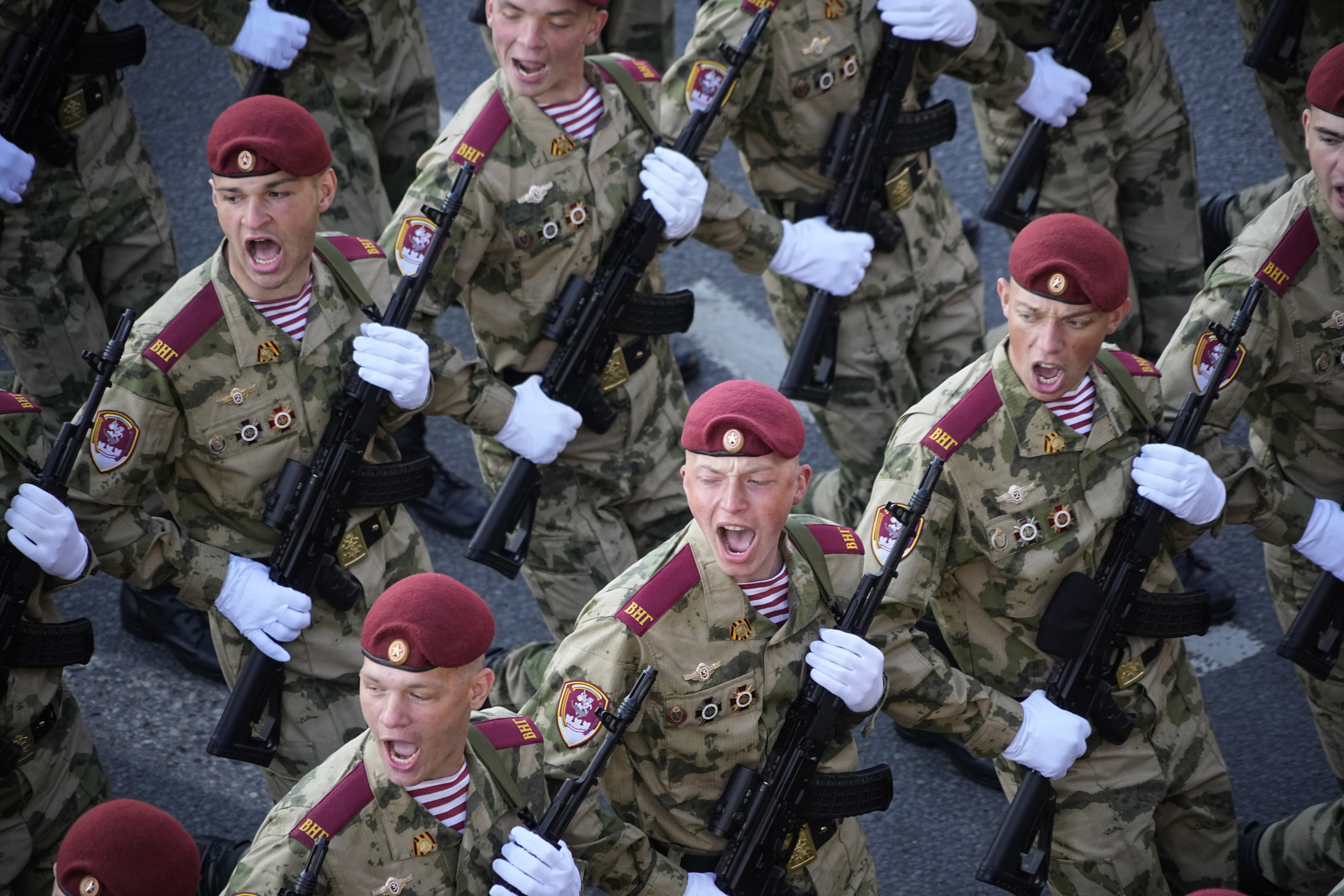 Russian soldiers march towards Red Square to attend a Victory Day parade