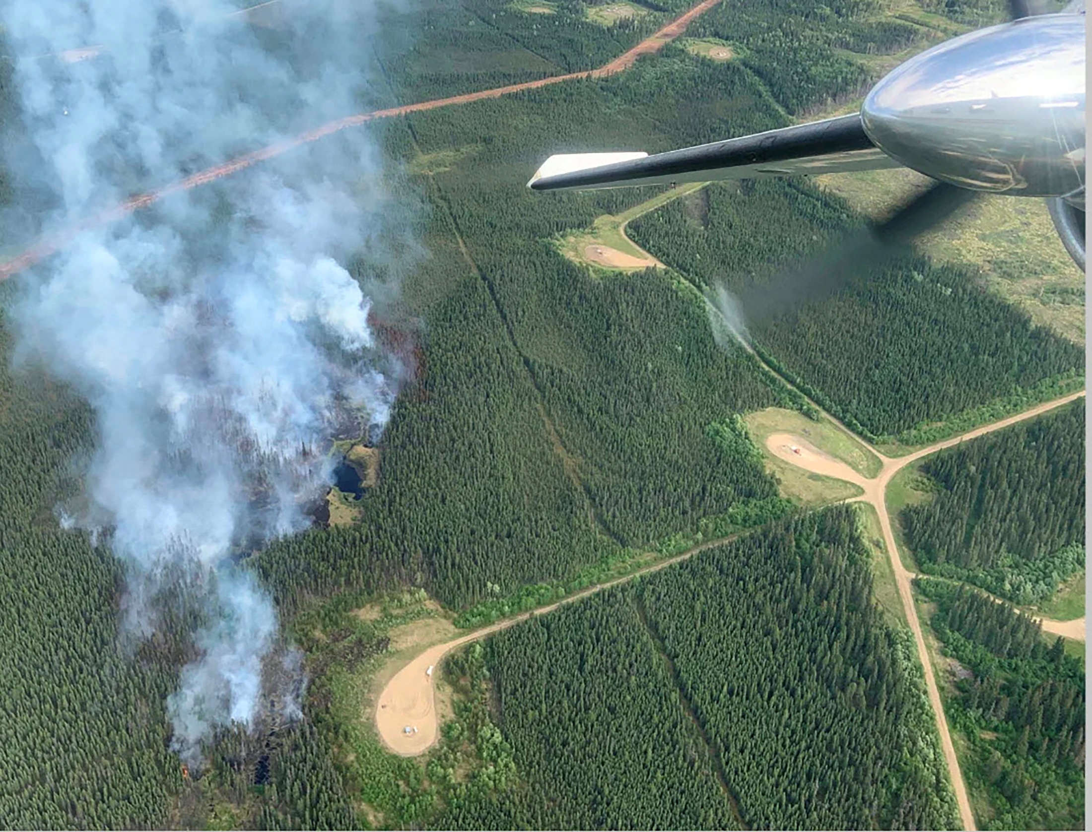 Smoke rises from a wildfire in the Canadian province of Alberta on June 4, 2023