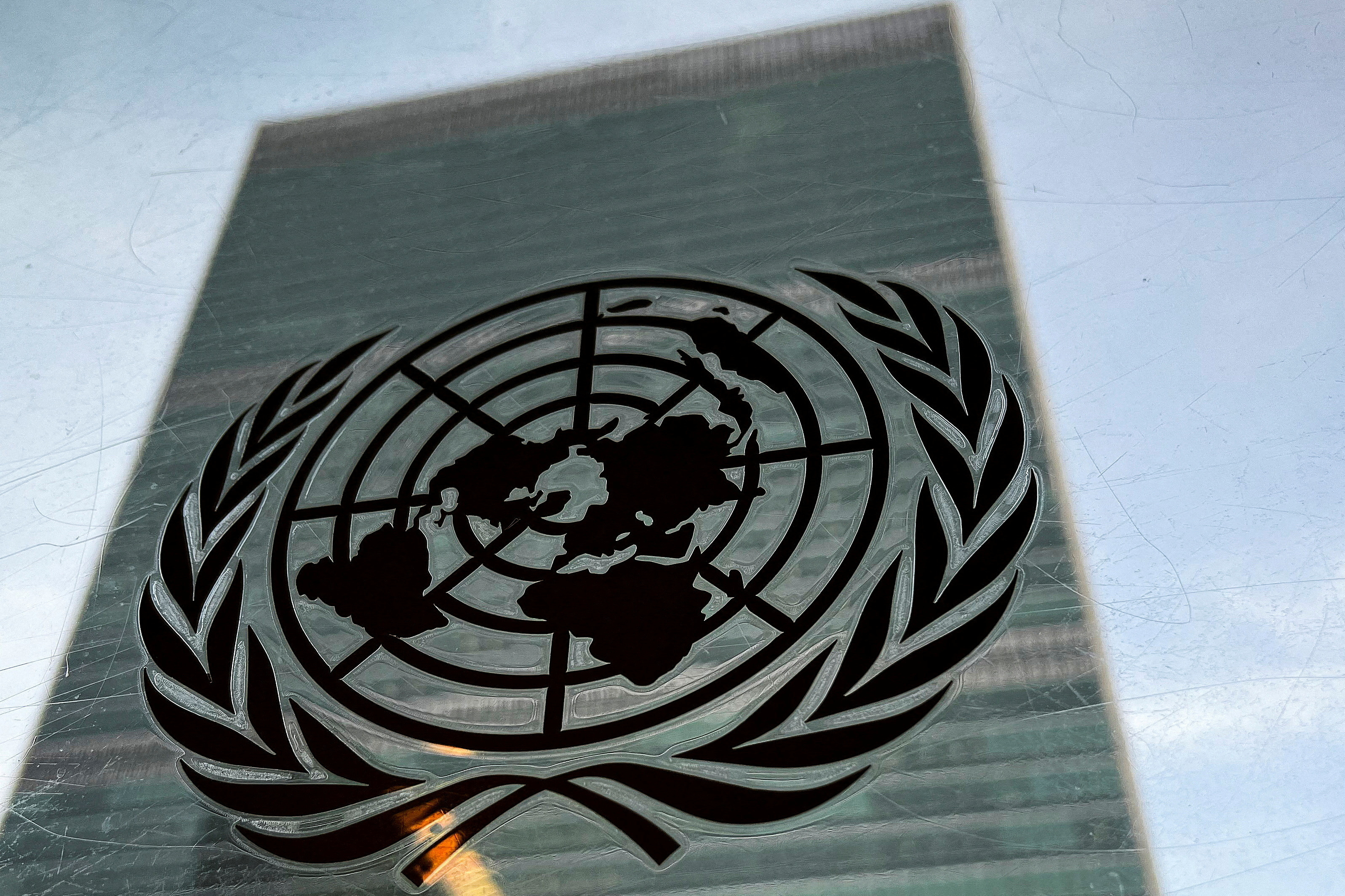 FILE PHOTO: The United Nations headquarters building is pictured with a UN logo in the Manhattan borough of New York City, New York, U.S., March 1, 2022. REUTERS/Carlo Allegri/File Photo