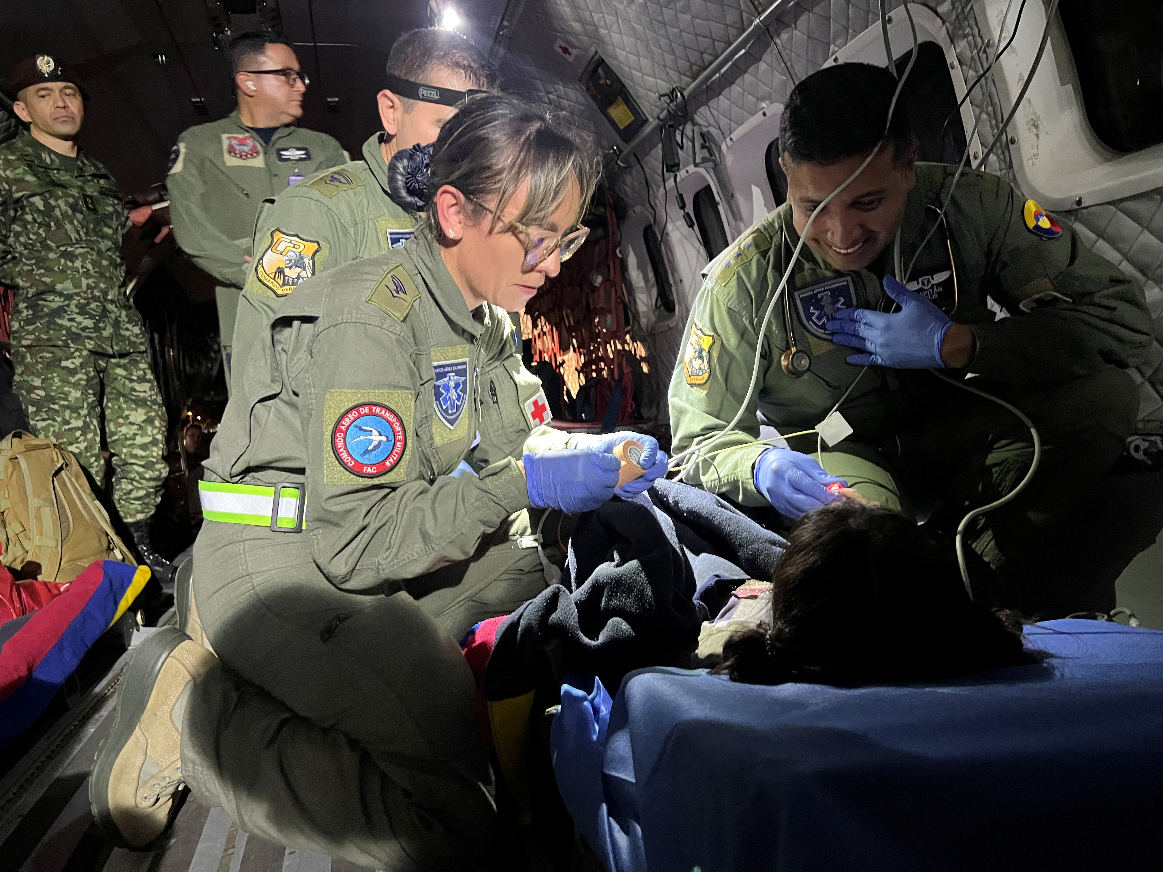 Colombian soldiers give medical attention inside a plane to the children who survived a Cessna 206 plane crash in the thick Amazon jungle at the beginning of May