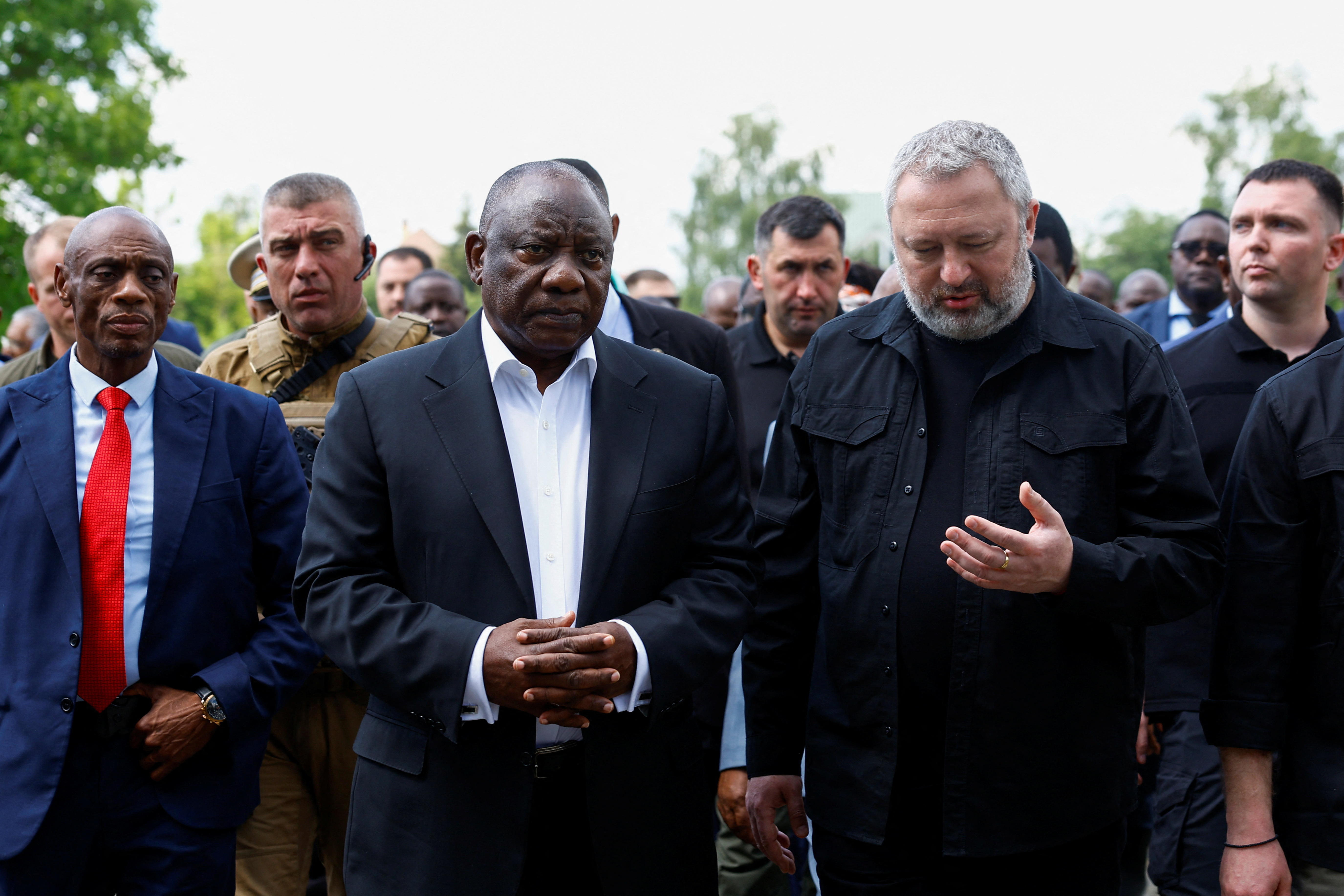 South African President Cyril Ramaphosa and Ukraine's Prosecutor General Andriy Kostin visit a site of a mass grave, in the town of Bucha, amid Russia's attack on Ukraine, outside of Kyiv, Ukraine June 16, 2023. 