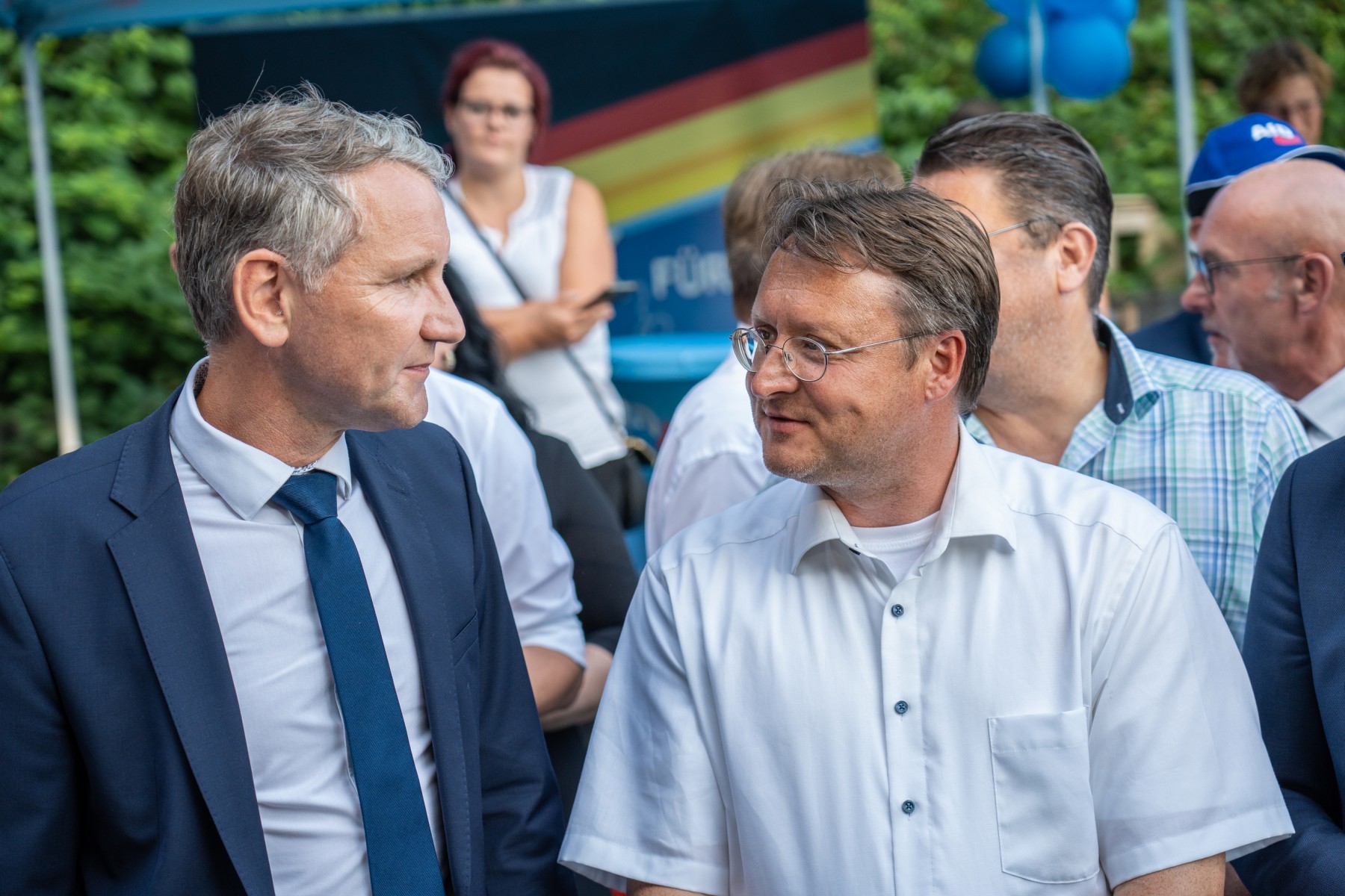 Robert Sesselmann, right, and Björn Höcke of the far-right AfD celebrate the party's first win in a district council election in Germany on June 25, 2023, in Sonneberg [Ferdinand Merzbach/NEWS5/AFP]