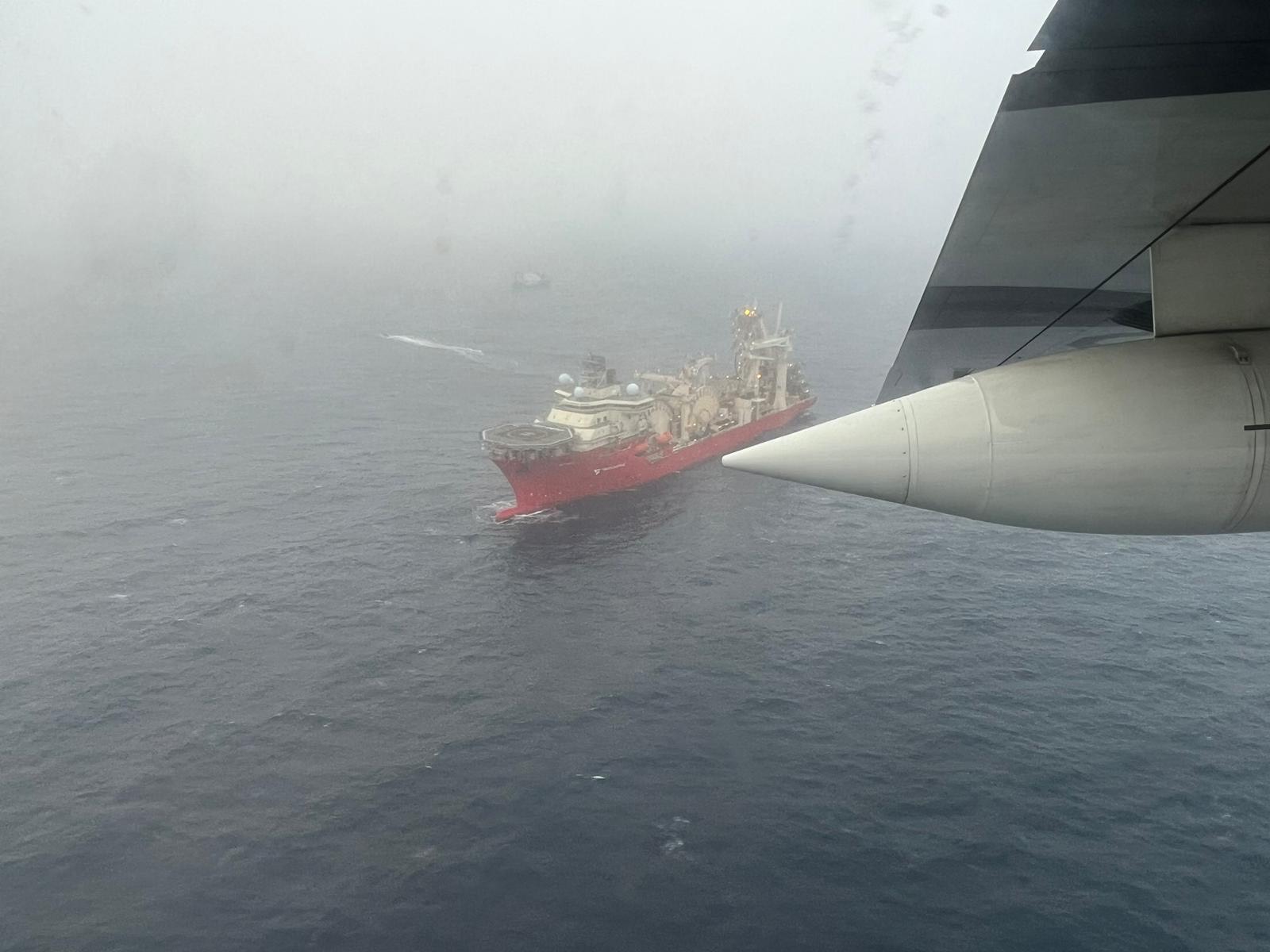 AT SEA - JUNE 20: (----EDITORIAL USE ONLY – MANDATORY CREDIT - " US COAST GUARD/ HANDOUT" - NO MARKETING NO ADVERTISING CAMPAIGNS - DISTRIBUTED AS A SERVICE TO CLIENTS----) An aerial view of the Bahamian research vessel Deep Energy ship after it was arrived in the area for OceanGate Titan Submersible. Search and rescue operations continue by US Coast Guard in Boston after a tourist submarine bound for the Titanic's wreckage site went missing off the southeastern coast of Canada. ( Us Coast Guard - Anadolu Agency )