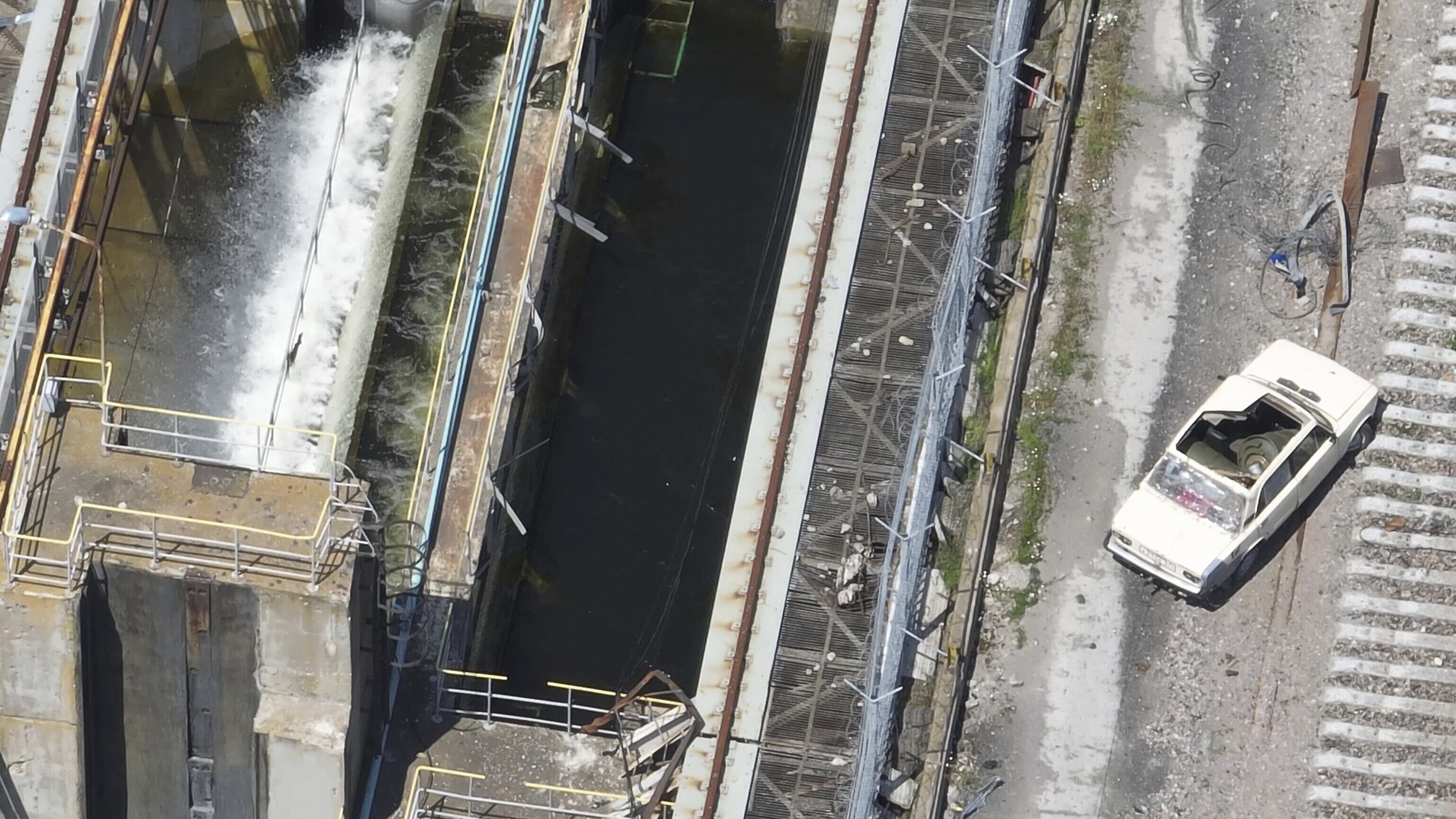 This photo taken from drone footage, provided by the Ukrainian military and dated May 28, shows a car on the Kakhovka Dam that appears to be laden with explosives. The dam collapsed on June 6, while it was under Russian control [Ukrainian military via AP]
