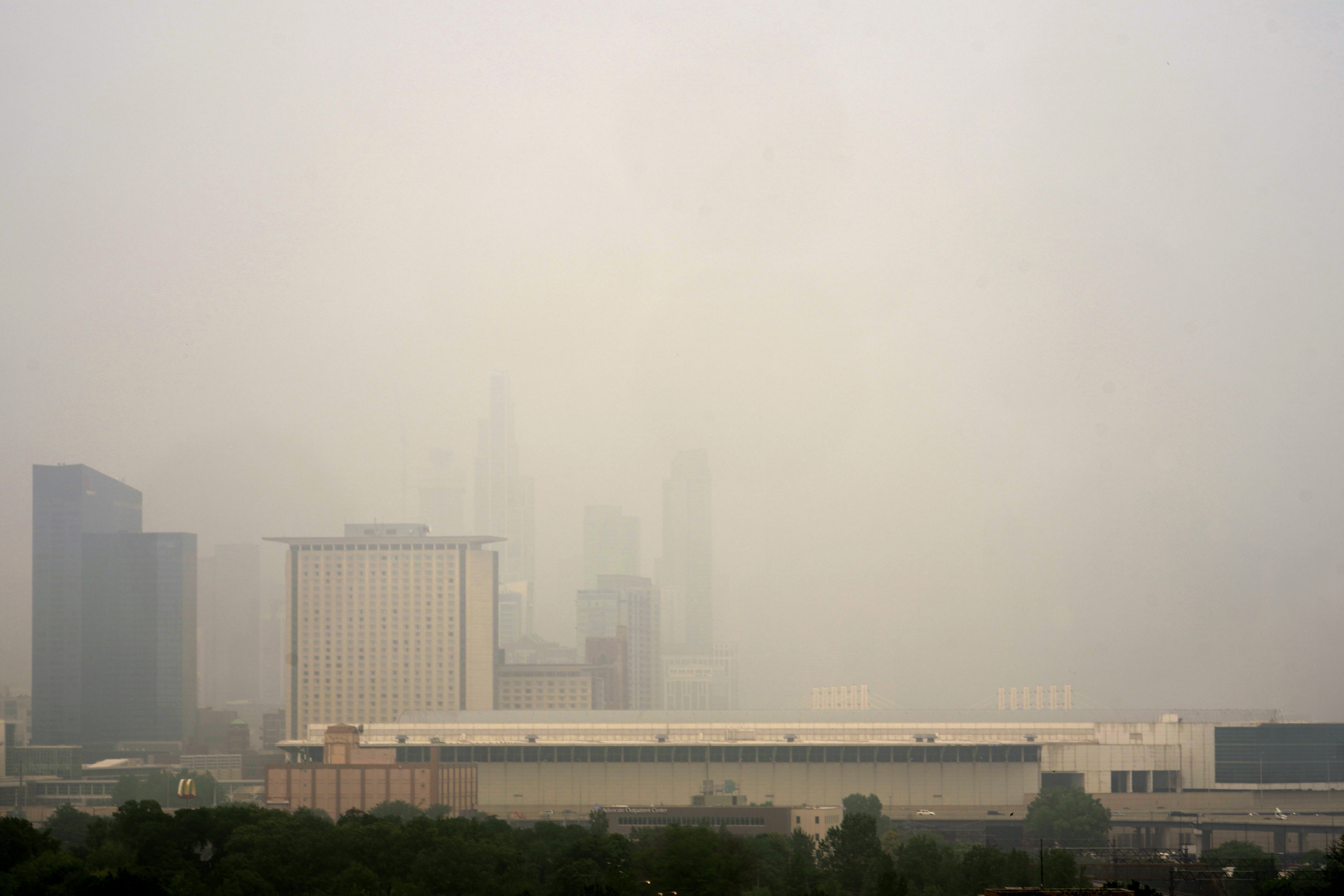 The Marriott Marquis hotel, left, and the Hyatt Regency McCormick Place in a veil of smoke as Canadian wildfires obscure the Chicago skyline
