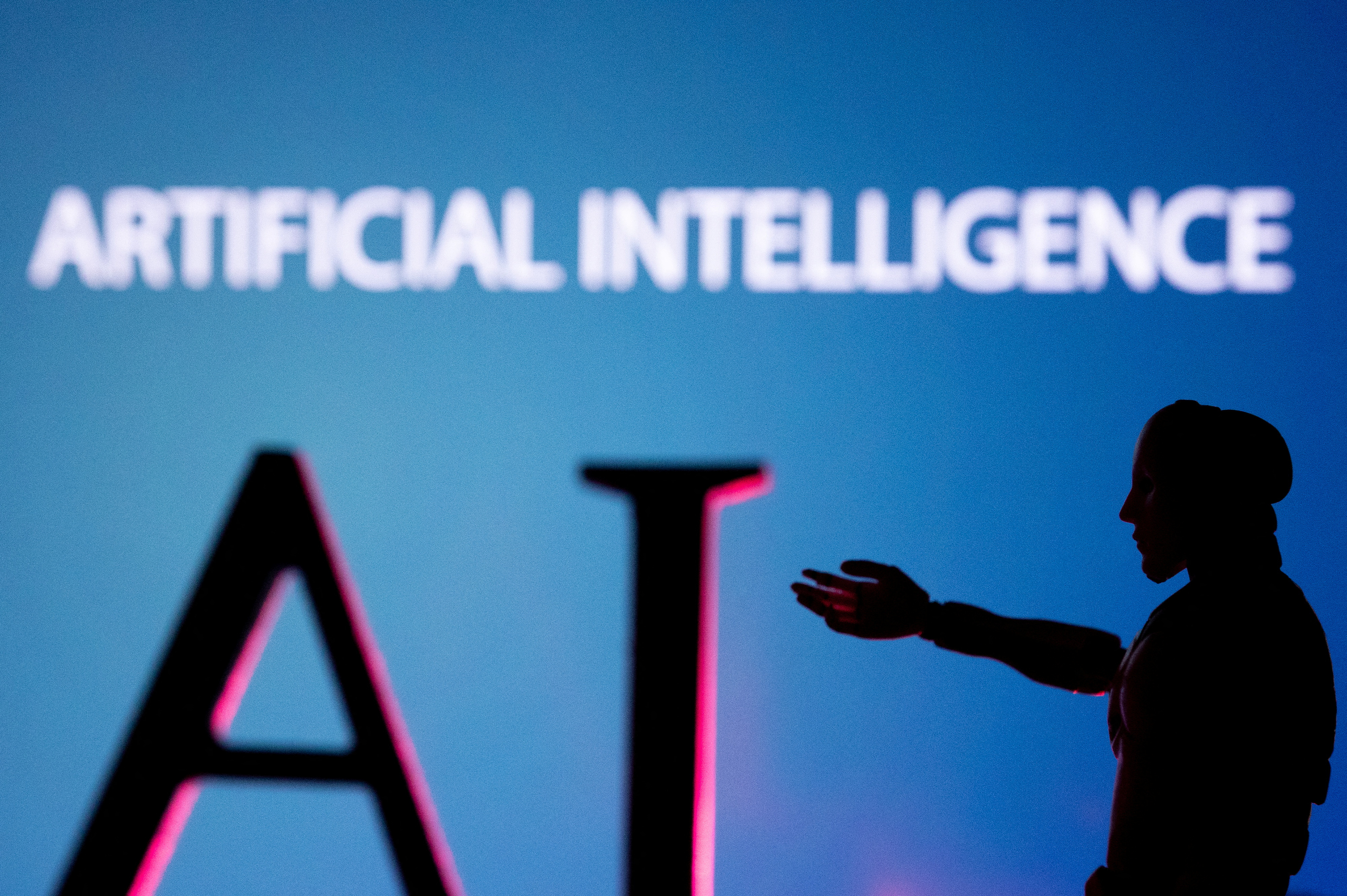 AI (Artificial Intelligence) letters and robot miniature in this illustration taken, June 23, 2023