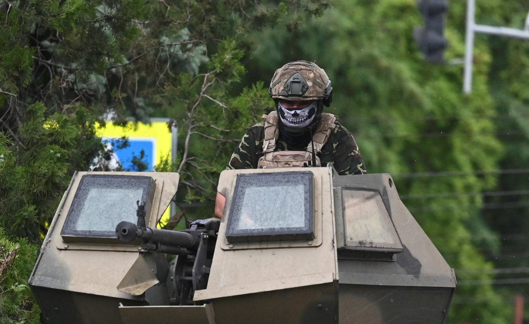 A fighter of Wagner private mercenary group is seen atop of an armoured vehicle in a street near the headquarters of the Southern Military District in the city of Rostov-on-Don, Russia, June 24, 2023. REUTERS/Stringer