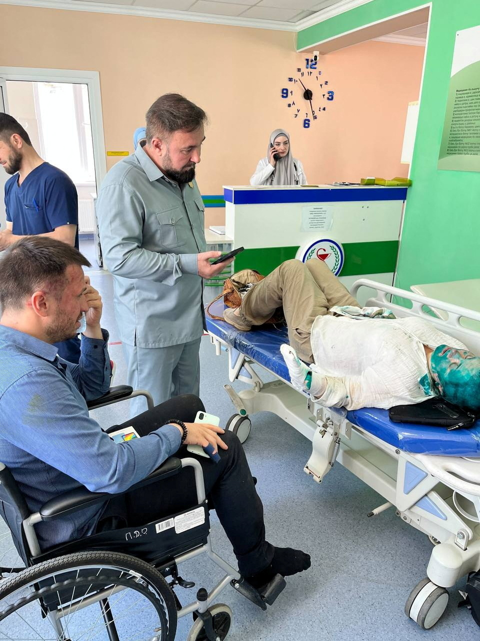 Human Rights Commissioner in the Chechen Republic Mansur Soltaev visits Yelena Milashina, a journalist for the now-banned independent newspaper Novaya Gazeta, and lawyer Alexander Nemov in hospital after they were attacked on their way to the Chechen capital Grozny from the local airport, in Grozny, Russia July 4, 2023. Crew Against Torture/Handout via REUTERS ATTENTION EDITORS - THIS IMAGE WAS PROVIDED BY A THIRD PARTY. NO RESALES. NO ARCHIVES. MANDATORY CREDIT.