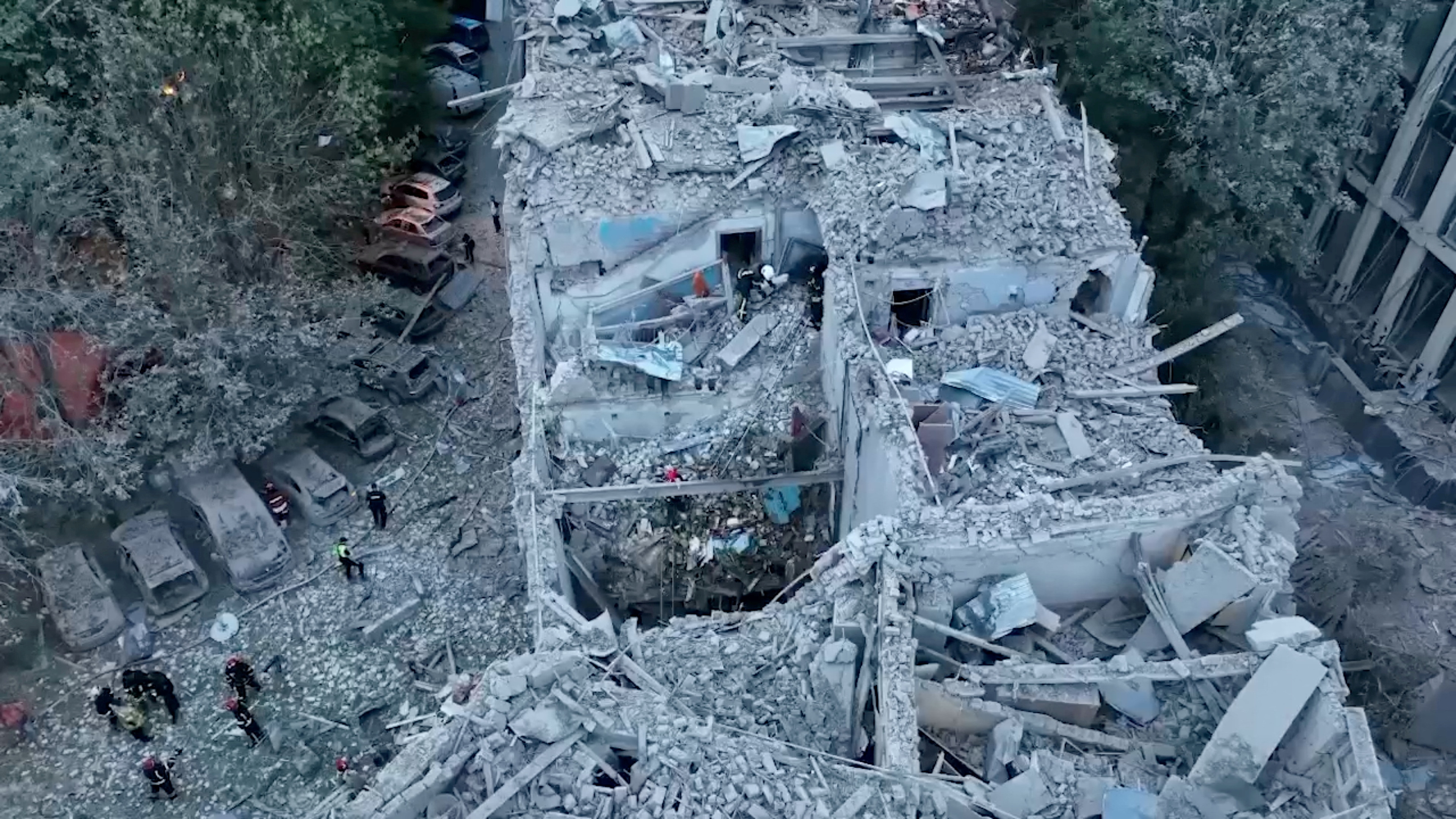Rescue workers respond to a Russian rocket strike that hit an apartment building, amid Russia's attack on Ukraine, in Lviv, Ukraine in this screen grab obtained from a handout video released on July 6, 2023. Presidential Press Service/Handout via REUTERS THIS IMAGE HAS BEEN SUPPLIED BY A THIRD PARTY TPX IMAGES OF THE DAY