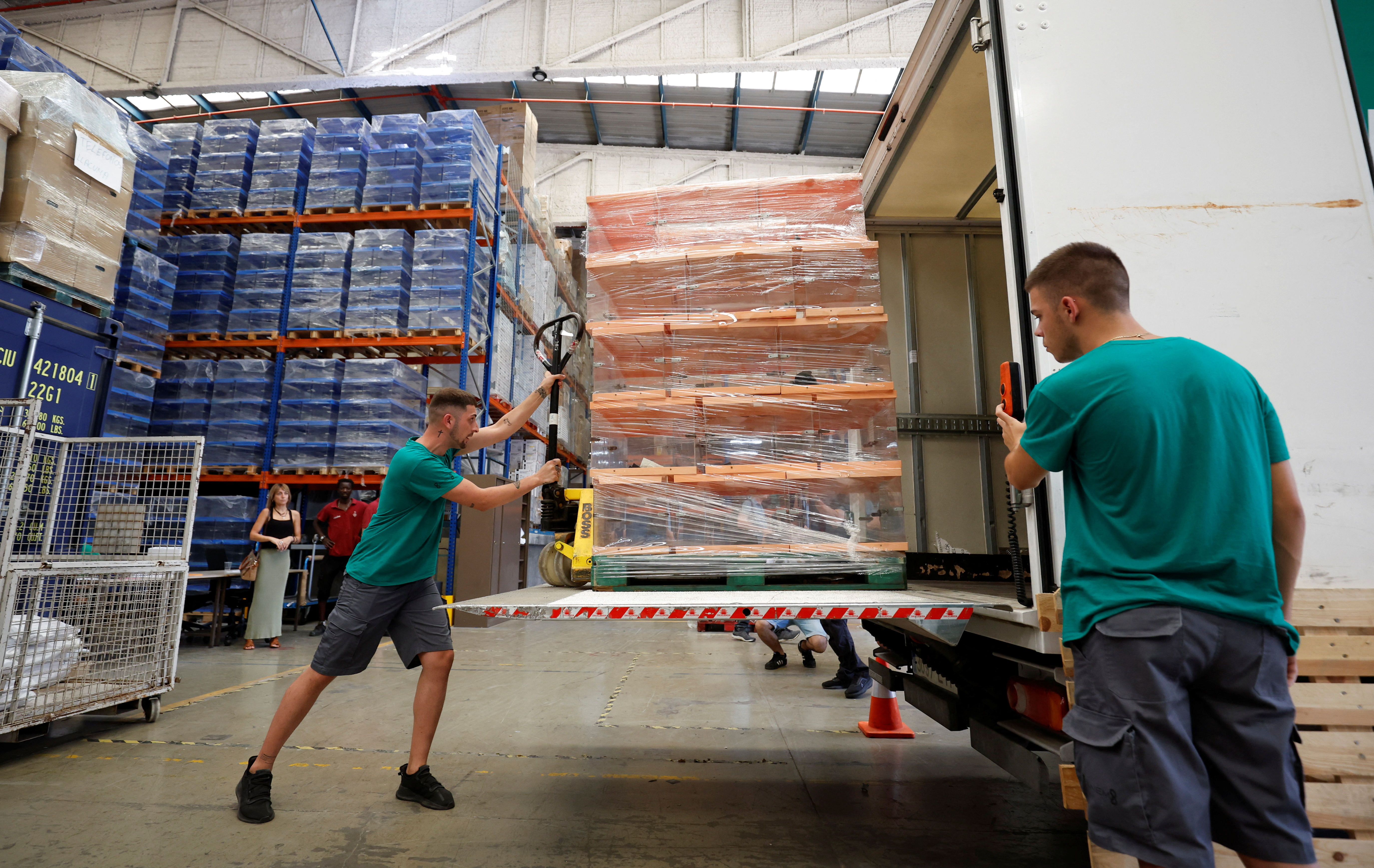Workers load ballot boxes