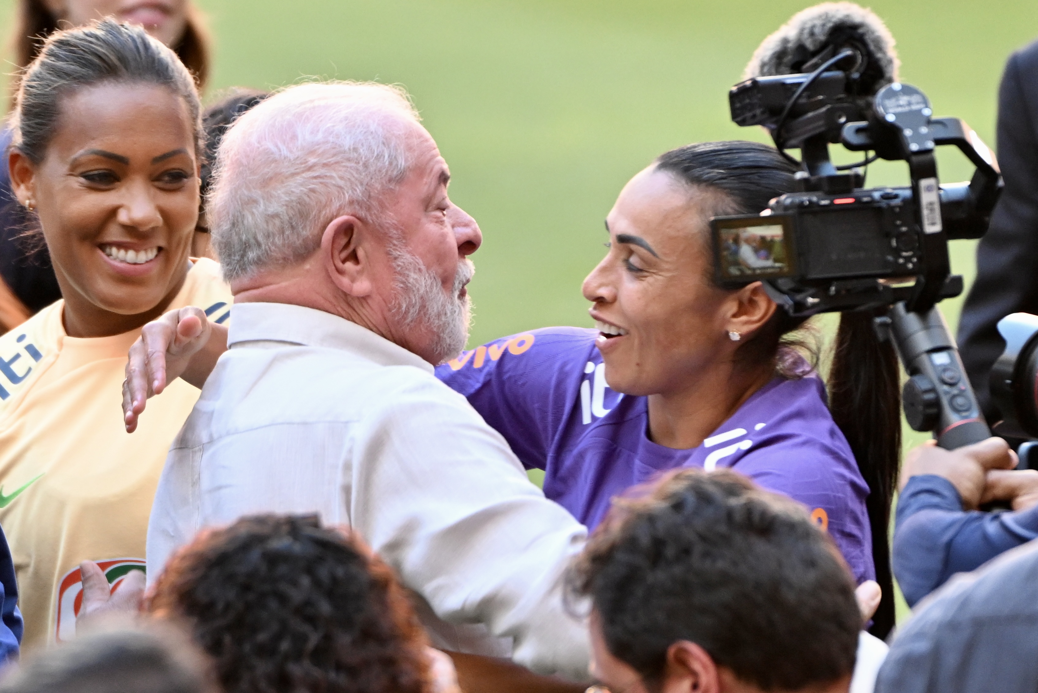 Brazilian President Luiz Inacio Lula da Silva hugs player Marta during a meeting with the women’s soccer national team at the Mane Garrincha Stadium in Brasilia