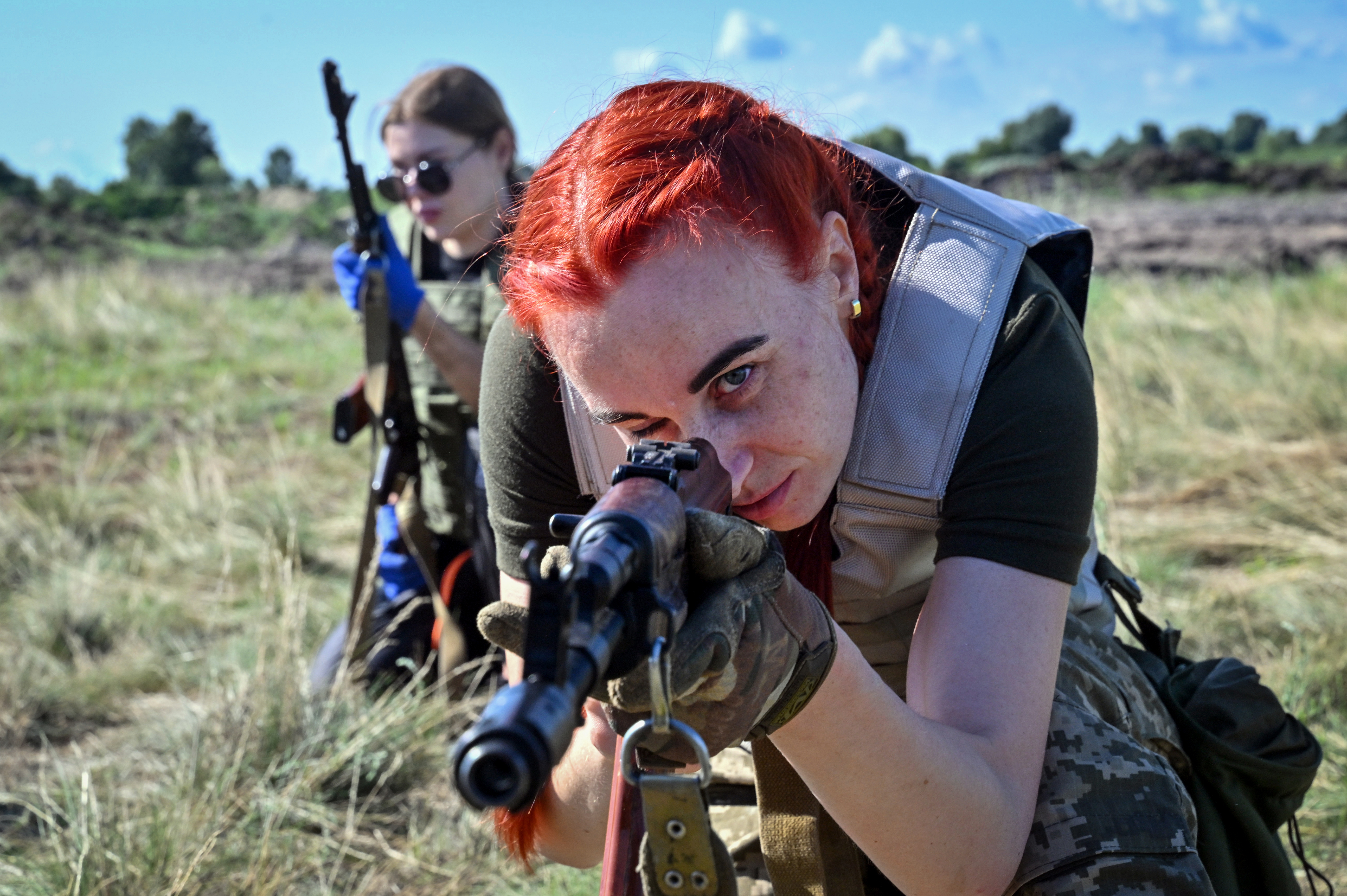 Female Ukrainian cadets, wearing new military uniforms designed specially for women, take part in a training on the outskirts of Kyiv on July 12, 2023.