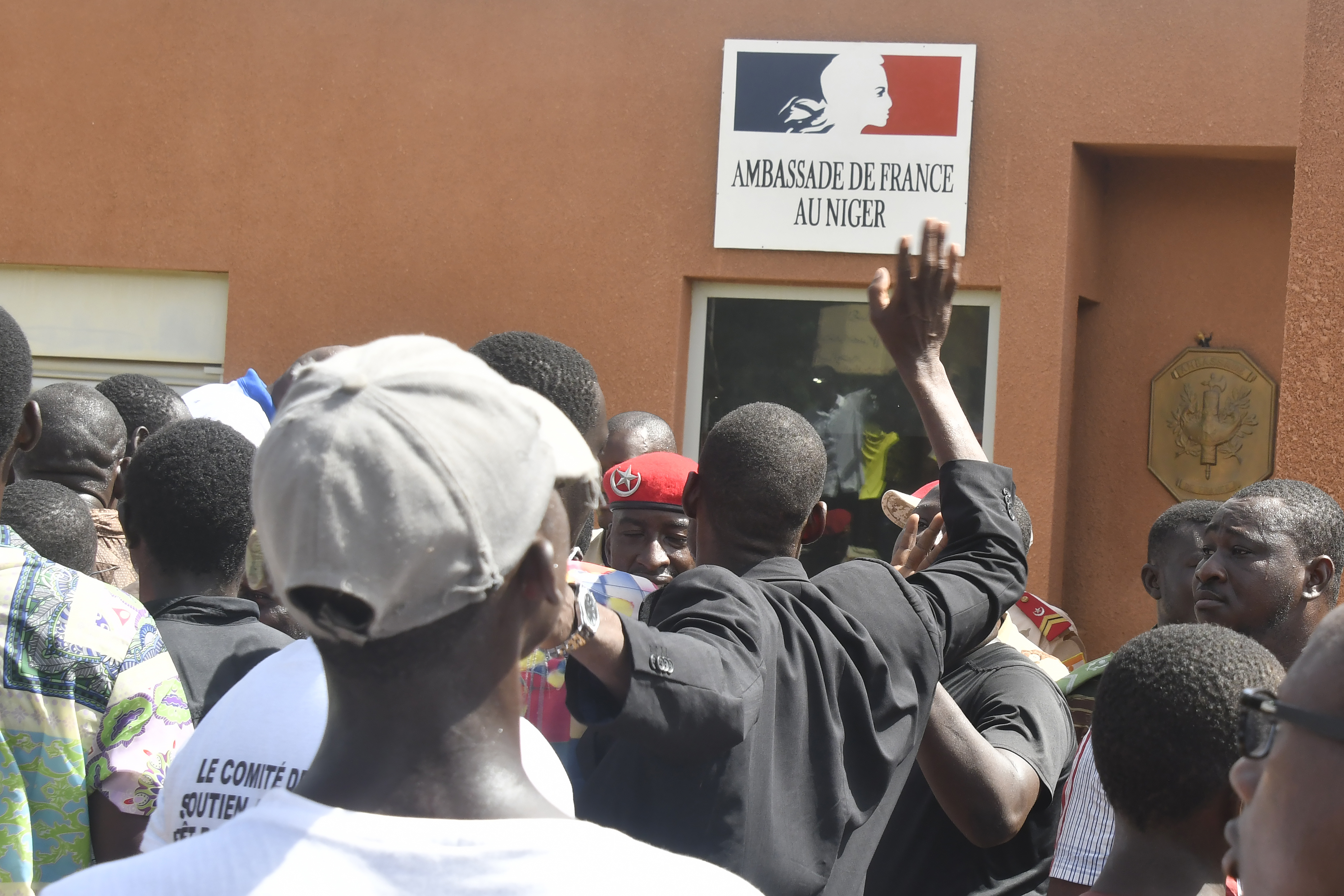 Protesters gather in front of the French Embassy