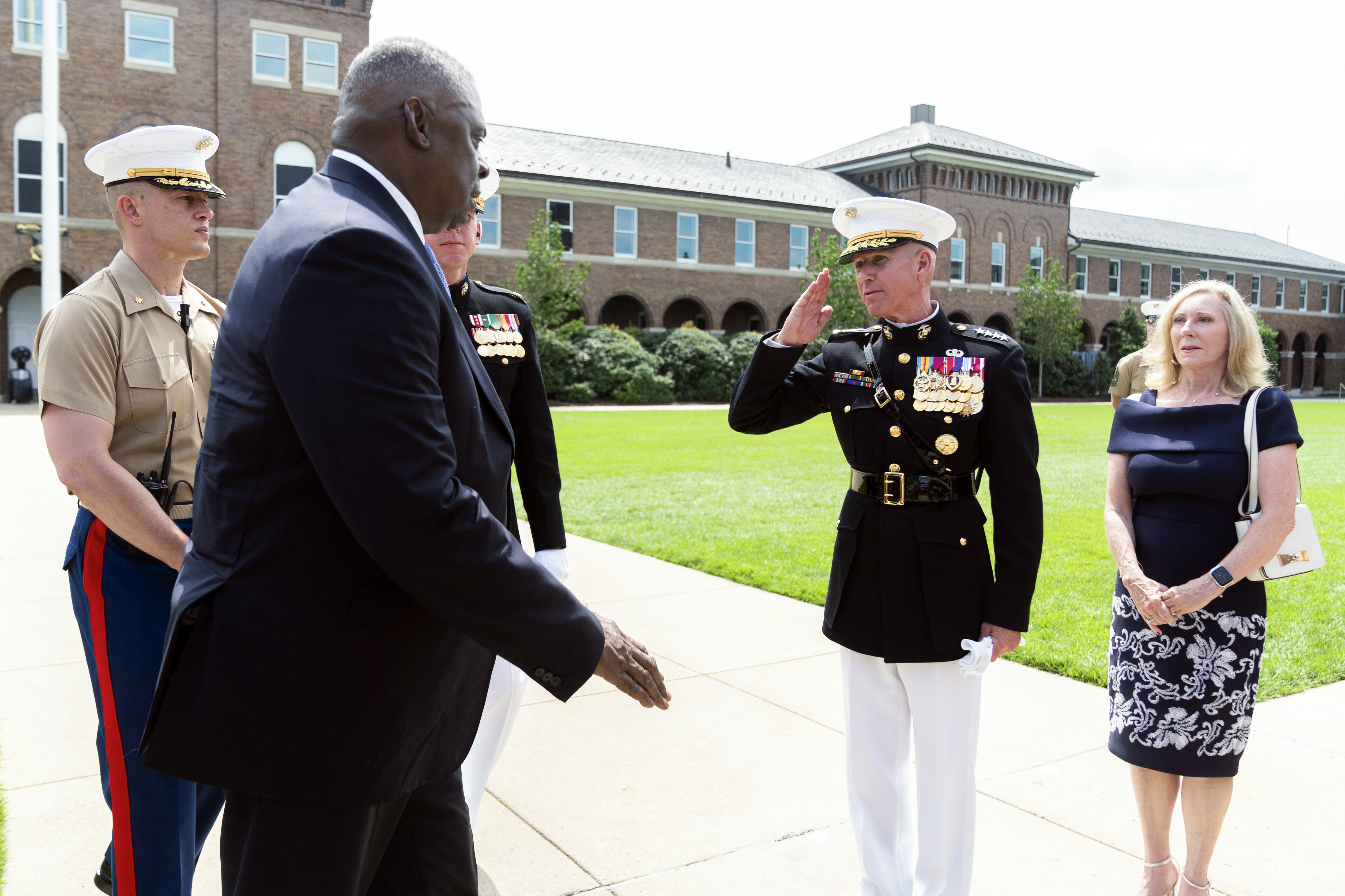 Defence Secretary Lloyd Austin (second from left) greets acting Marine Commandant Eric Smith (second from right) on July 10, at the Marine Barracks in Washington, DC