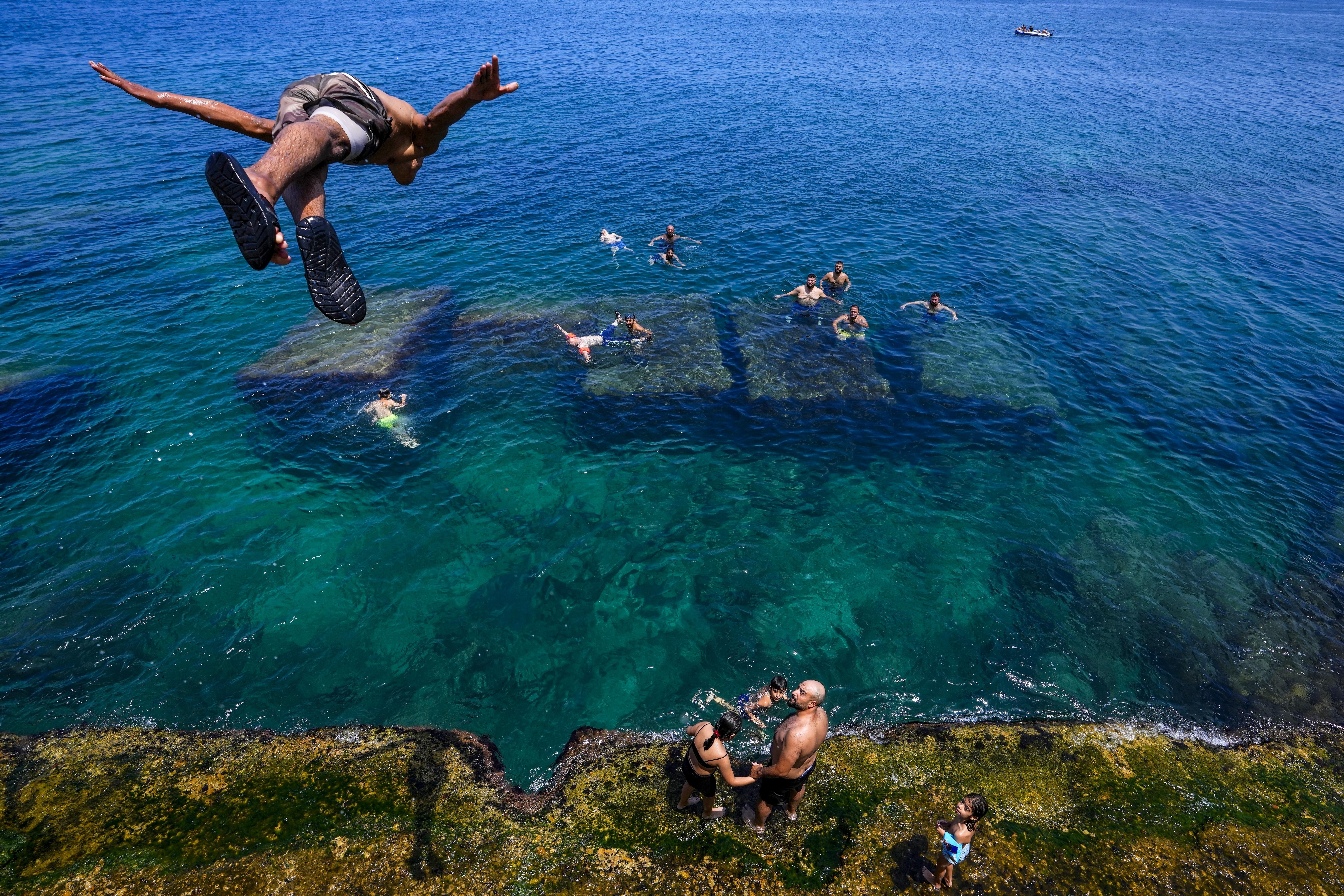 Around the world, millions feel the heat of an unrelenting summer