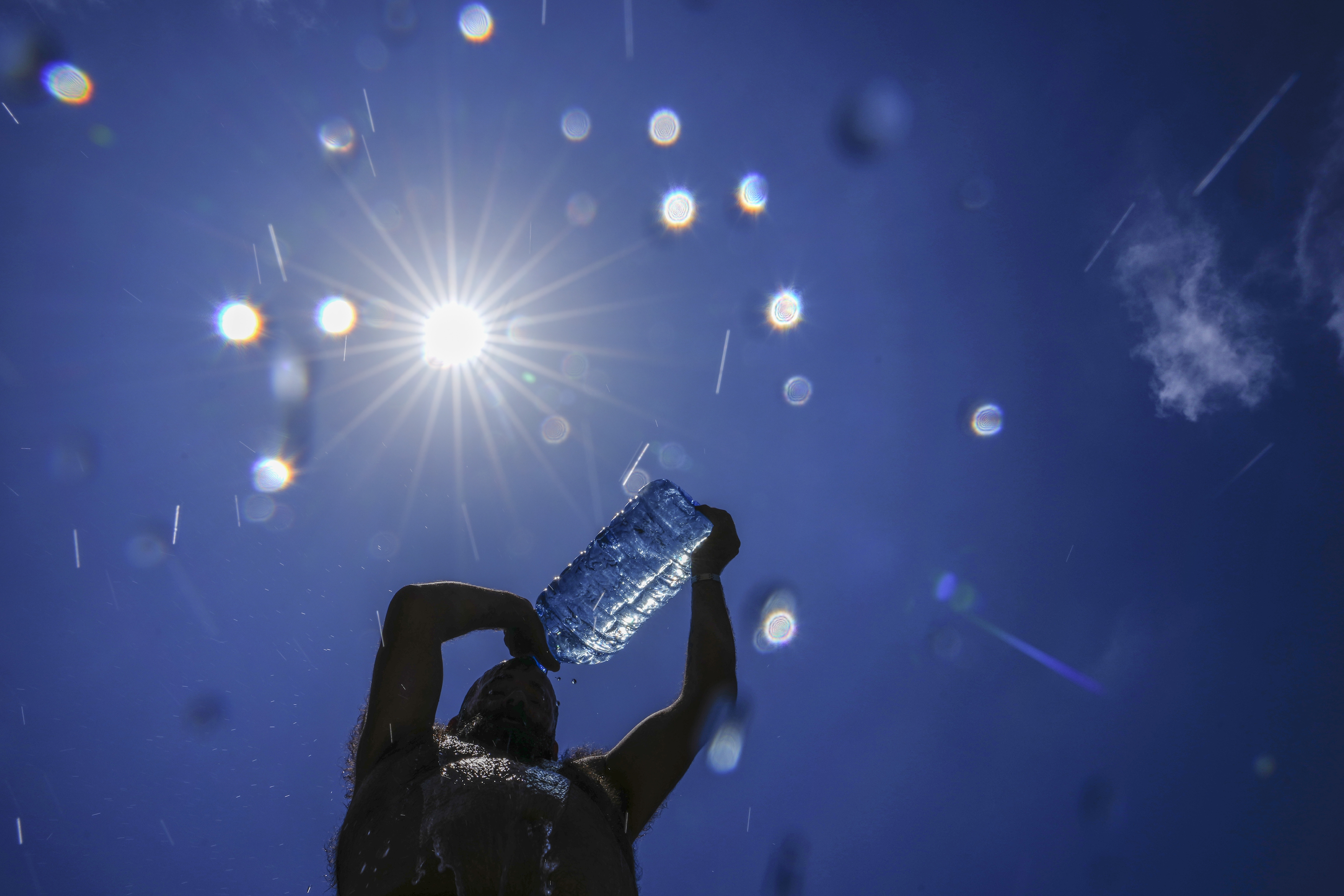 Around the world, millions feel the heat of an unrelenting summer