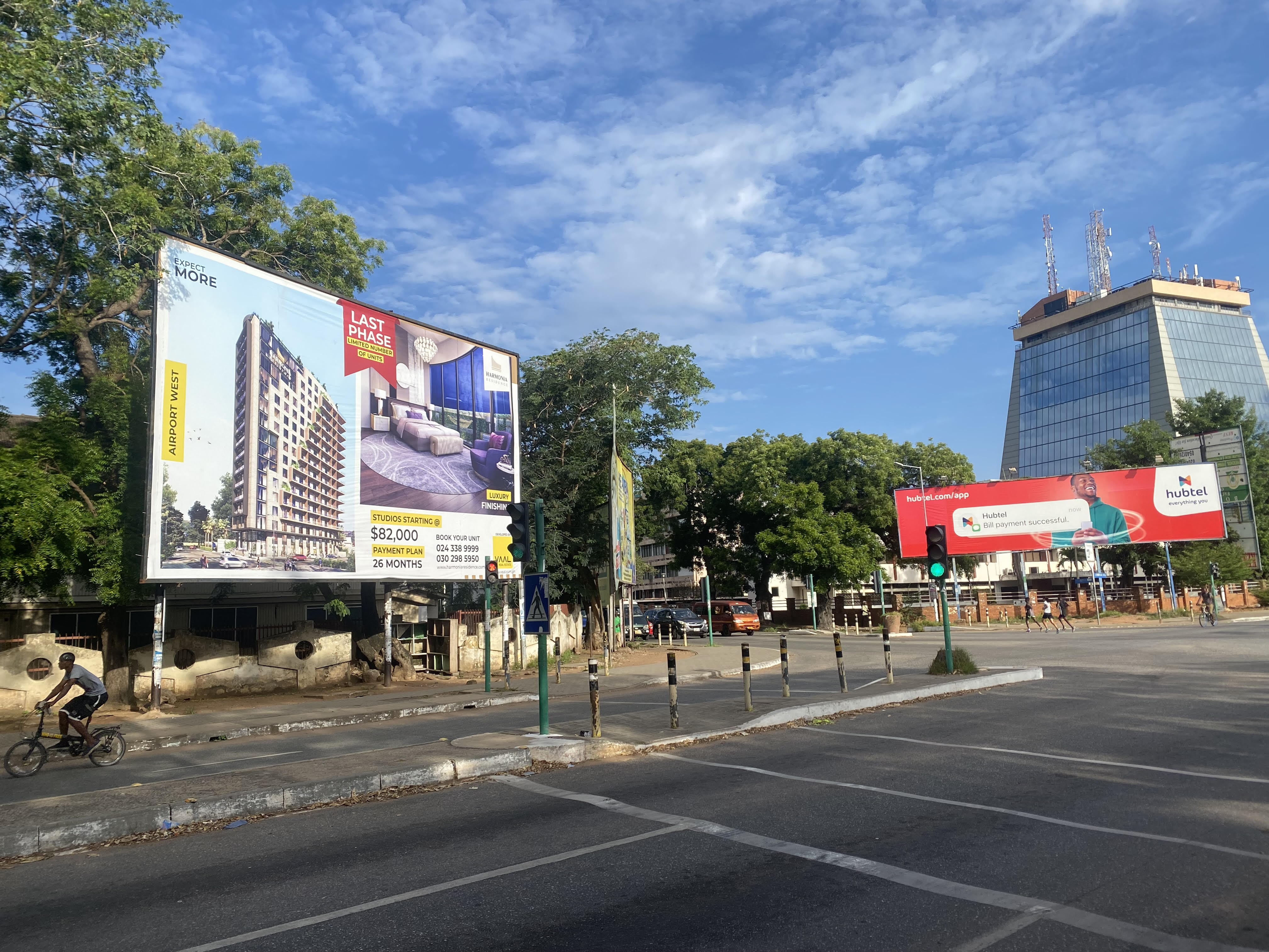 A billboard shows a dollar-denominated property for sale in the Airport West area of Accra, Ghana