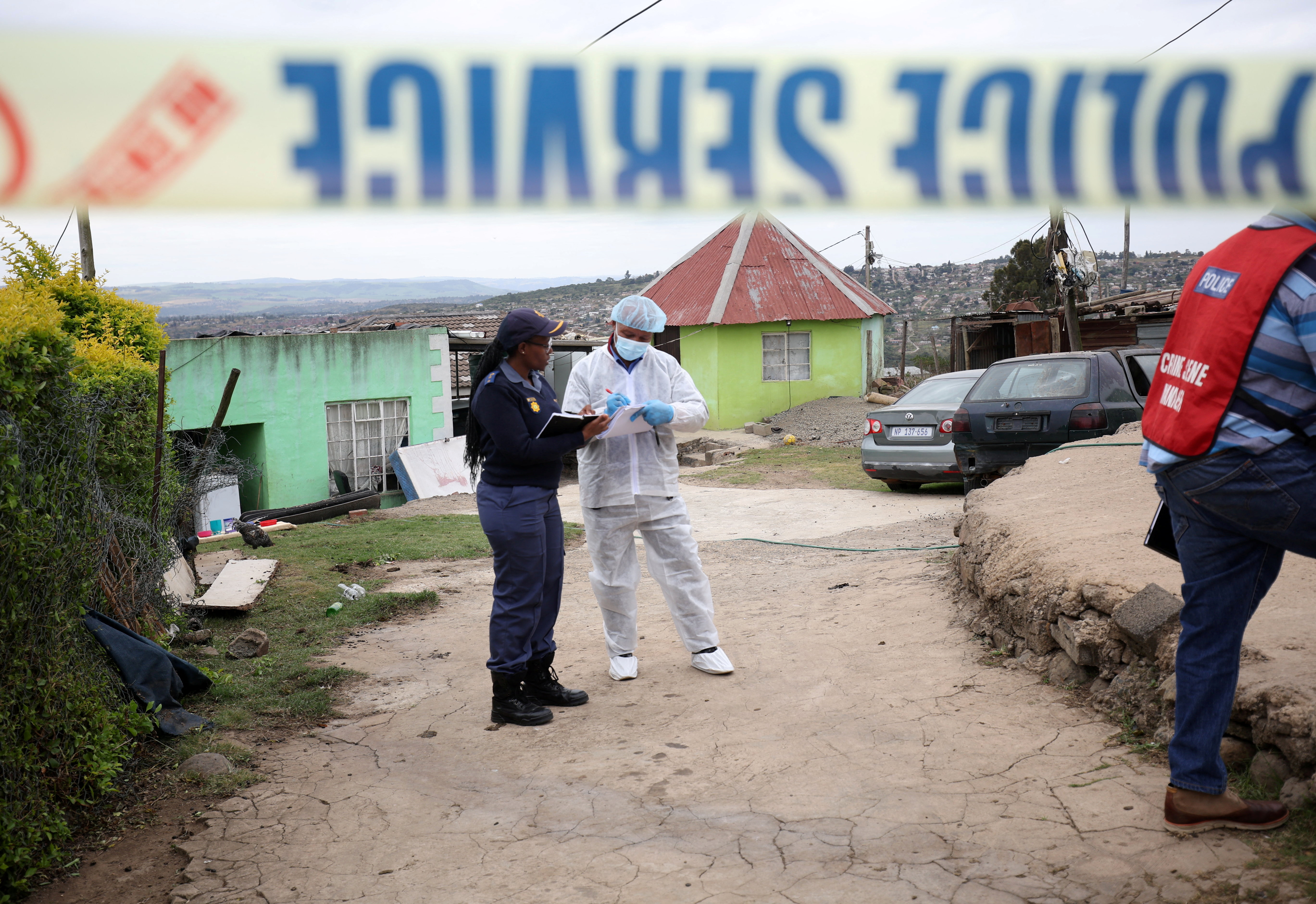 Police work at the scene of a deadly mass shooting near Pietermaritzburg, South Africa