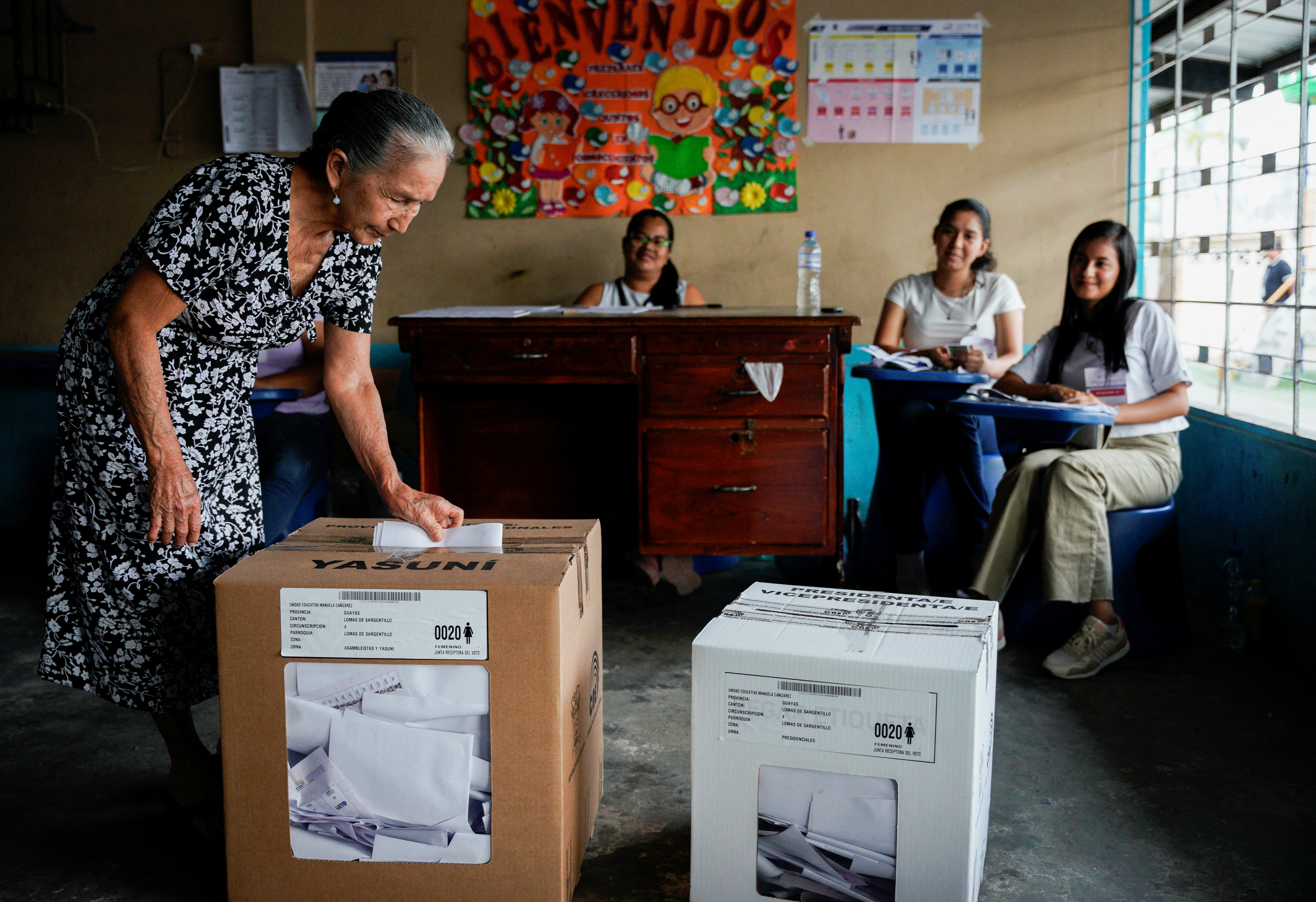 A woman casts her ballot at a polling station during the presidential election in Ecuador