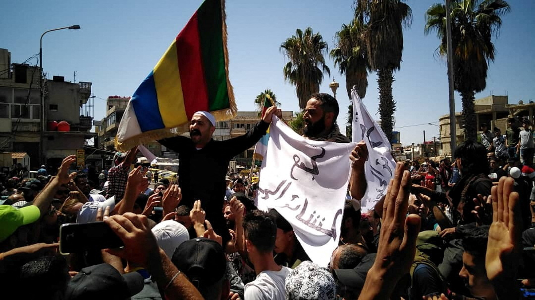 People protest against the latest decisions by Syrian government on increasing the prices of fuels in Sweida, Syria August 24, 2023 in this picture obtained from social media. Sweida 24/via REUTERS THIS IMAGE HAS BEEN SUPPLIED BY A THIRD PARTY. MANDATORY CREDIT. NO RESALES. NO ARCHIVES.