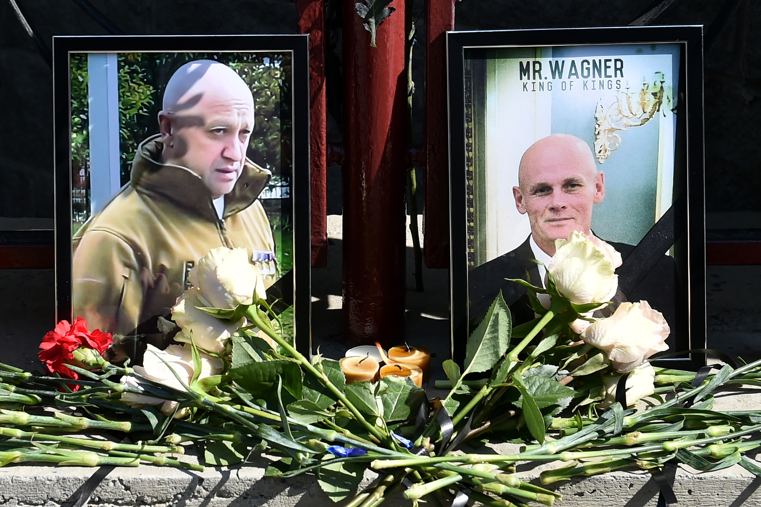 Portraits of Yevgeny Prigozhin, left, and Dmitry Utkin, right