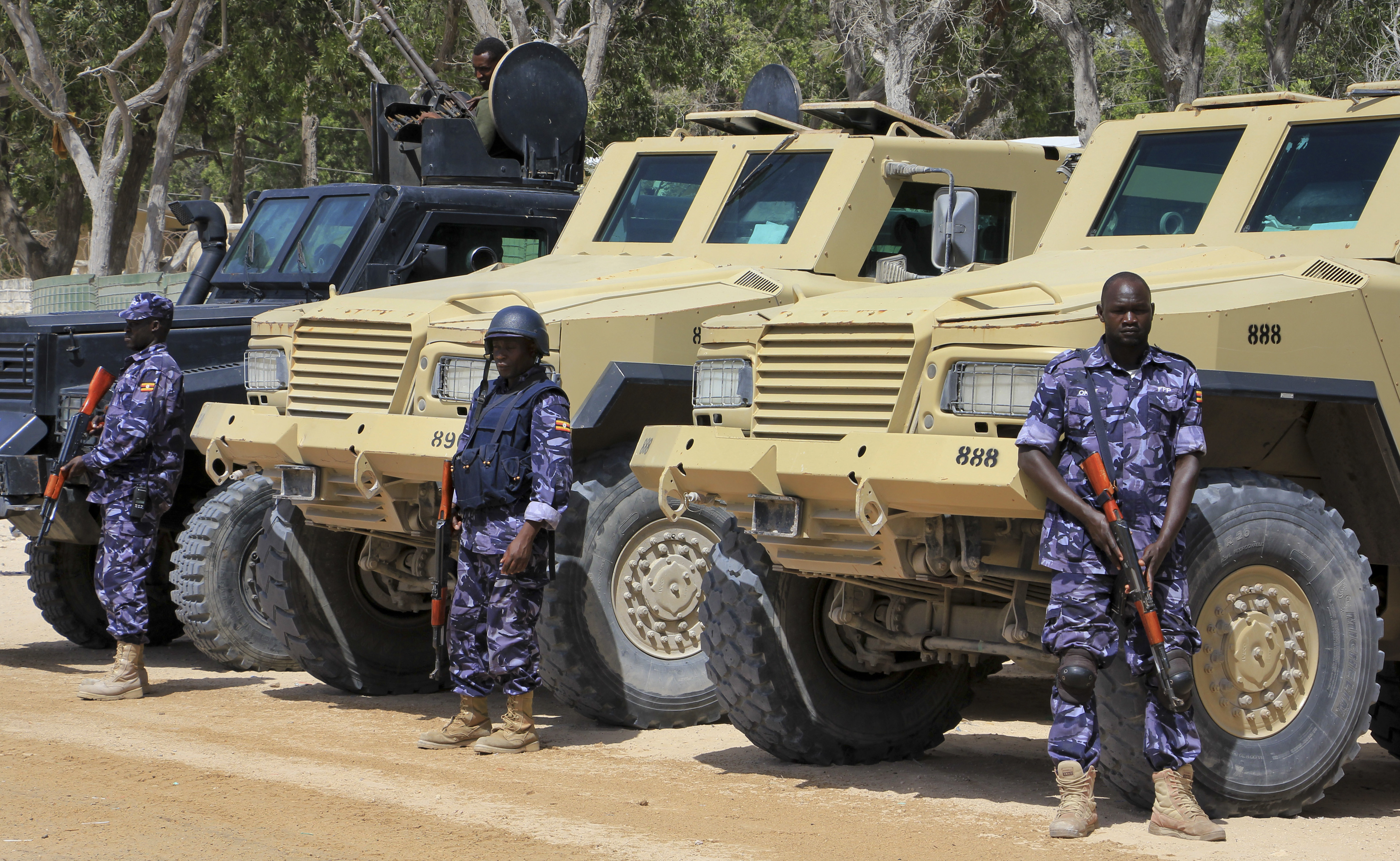 African Union (AU) soldiers stand with their armored vehicles near a checkpoint on the eve of presidential elections in Mogadishu, Somalia Tuesday, Feb. 7, 2017. Graft - vote-buying, fraud, intimidation - is the top concern in a nation that Transparency International now rates as the most corrupt in the world and Mogadishu is in lockdown because of the threat of violence by homegrown Islamic extremist group al-Shabab. (AP Photo/Farah Abdi Warsameh)