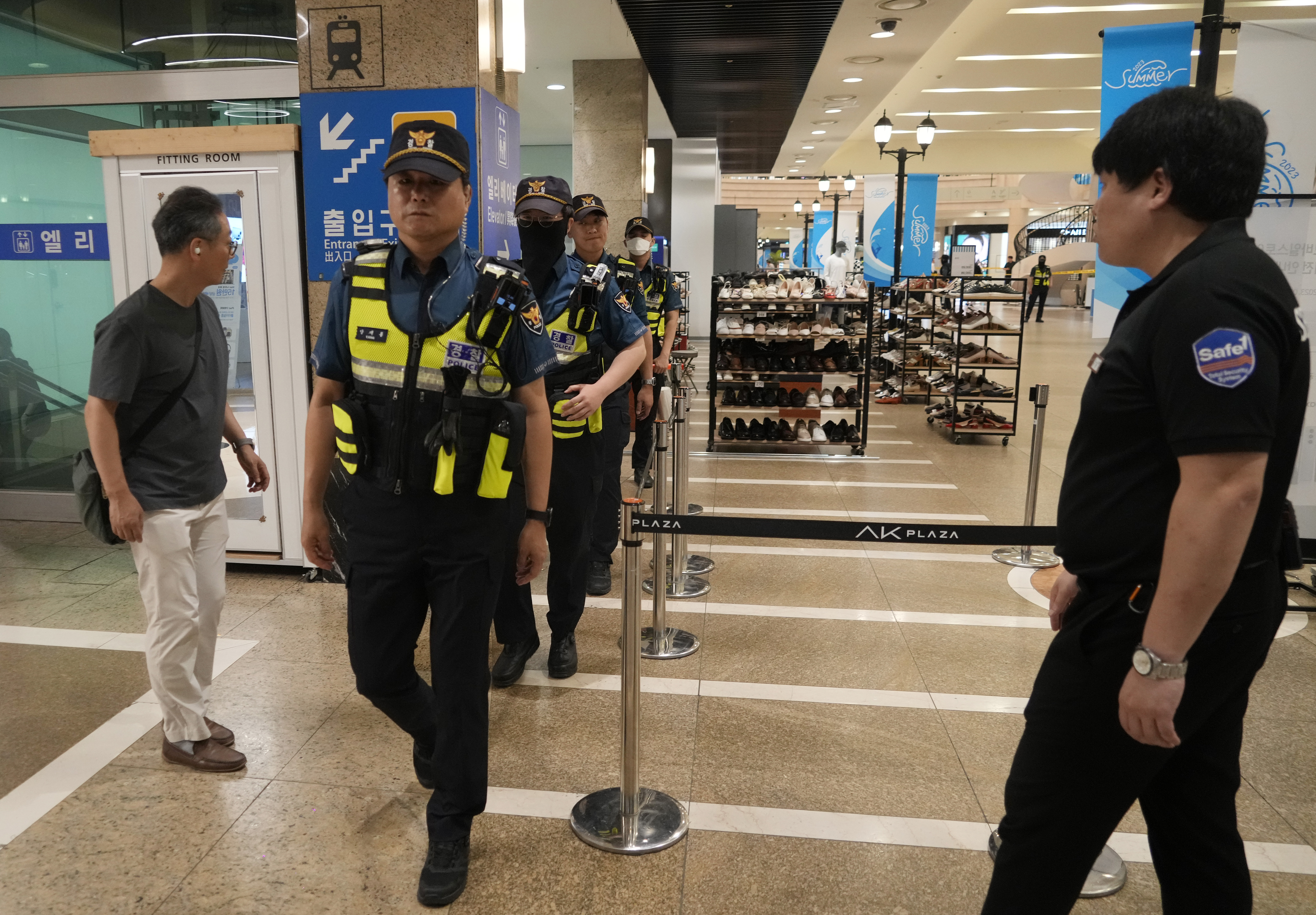 Police officers cordon off the scene near a subway station in Seongnam, South Korea