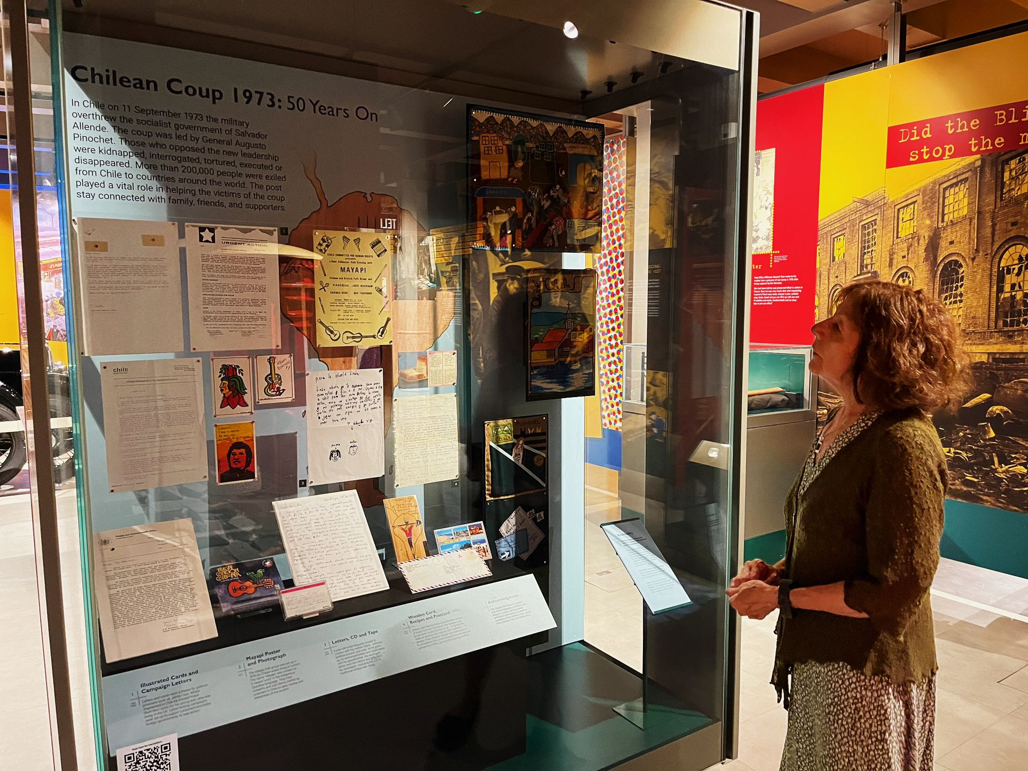 Gloria Miqueles gazes at the window display at the Postal Museum in London detailing 1973 coup in Chile
