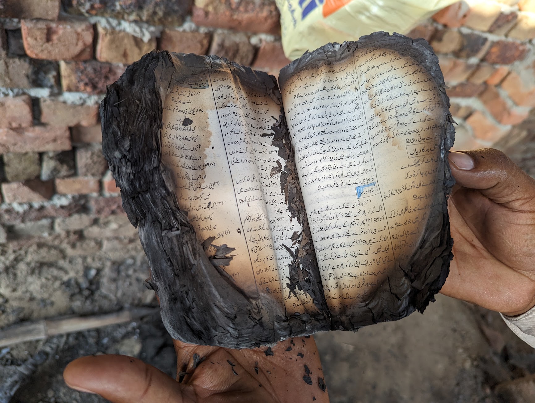 A copy of a Bible burned in Sat Sangat Duwaiya Church