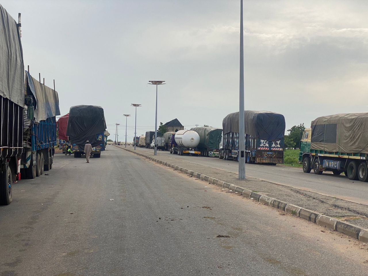 Freight trucks parked at the Jibiya border between Nigeria and Niger on August 10, 2023, due to the closure of borders between both countries after the July 26 coup [Al Jazeera]