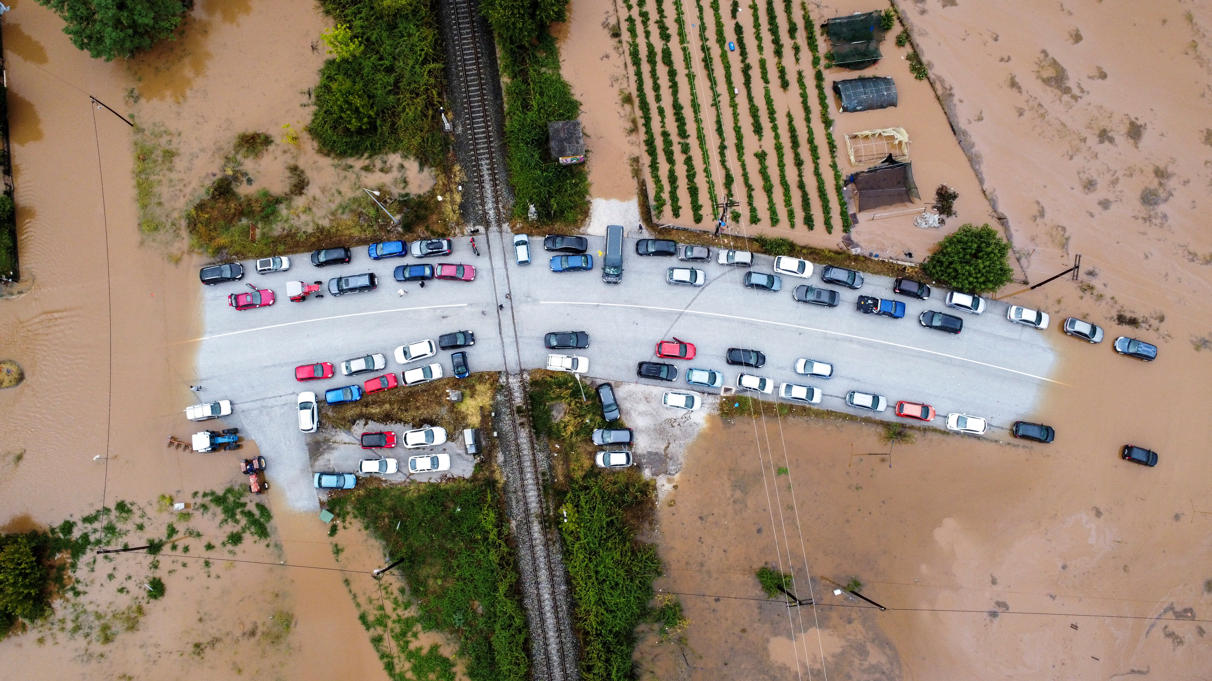Cars are stuck on a bridge surrounded by flood waters, as storm Daniel hits central Greece, in the village of Flamouli, near Trikala, Greece,