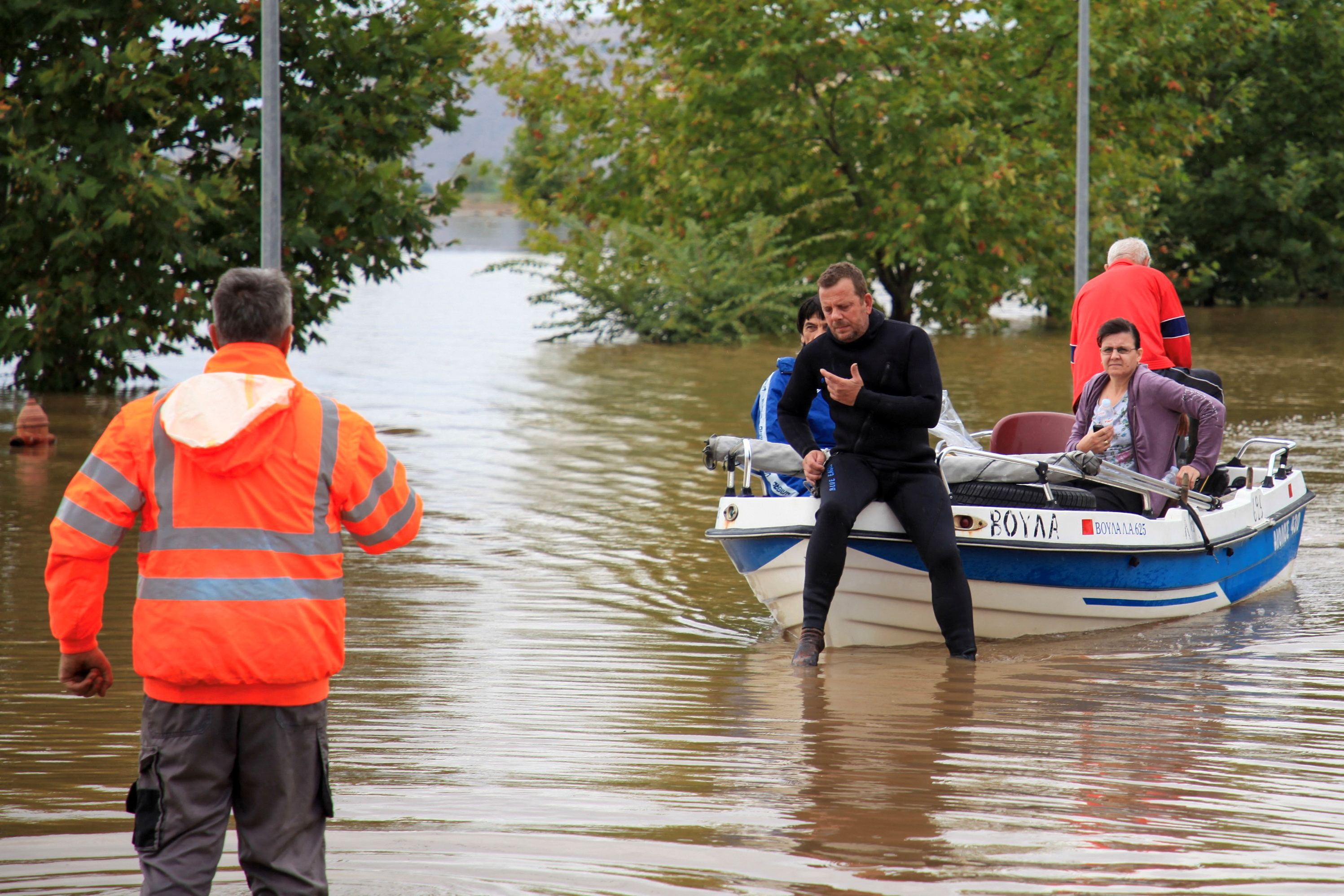 Locals are evacuated on a boat by volunteers, as storm Daniel hits central Greece, in Farkadona, Greece,