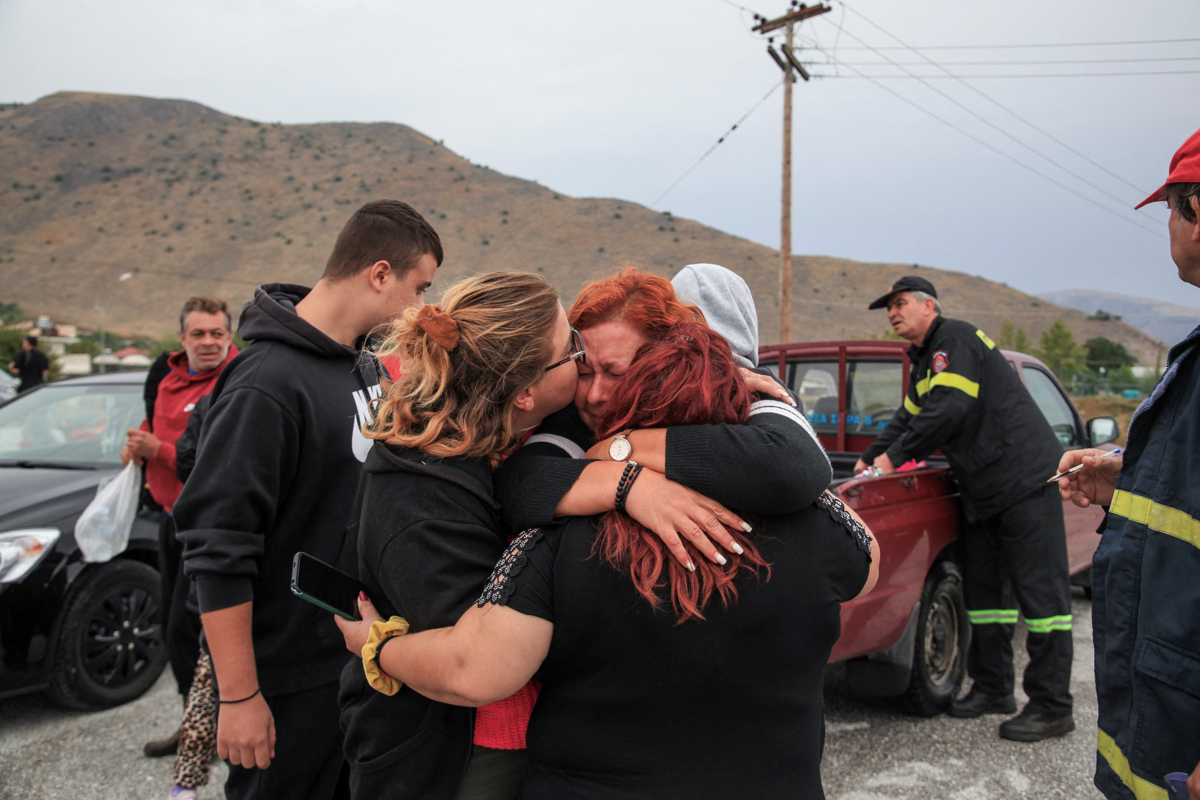 A woman reacts after being evacuated by volunteers, as storm Daniel hits central Greece, in Farkadona, Greece,