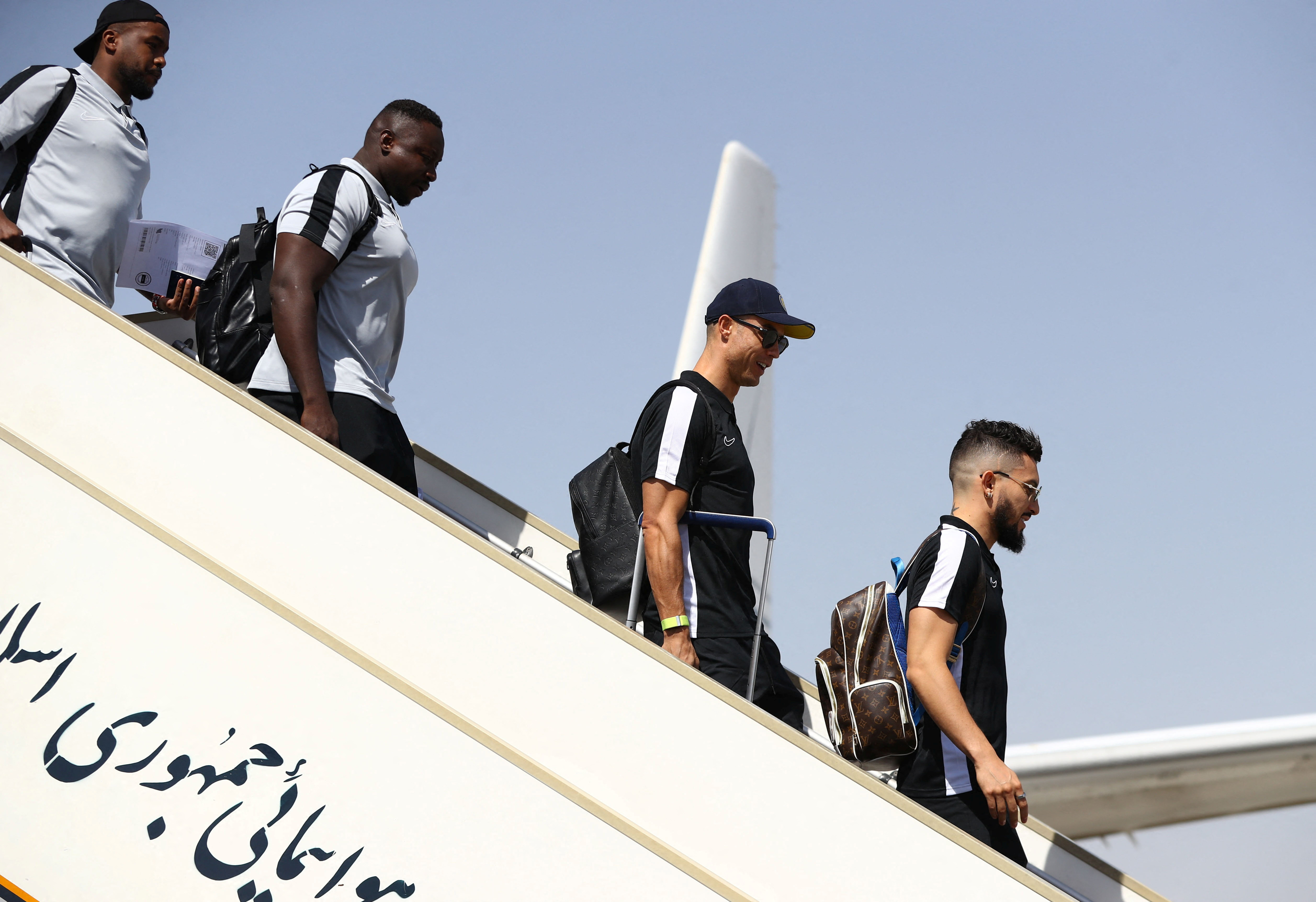 Al Nassr’s Cristiano Ronaldo and teammates arrive at Imam Khomeini International Airport in Tehran