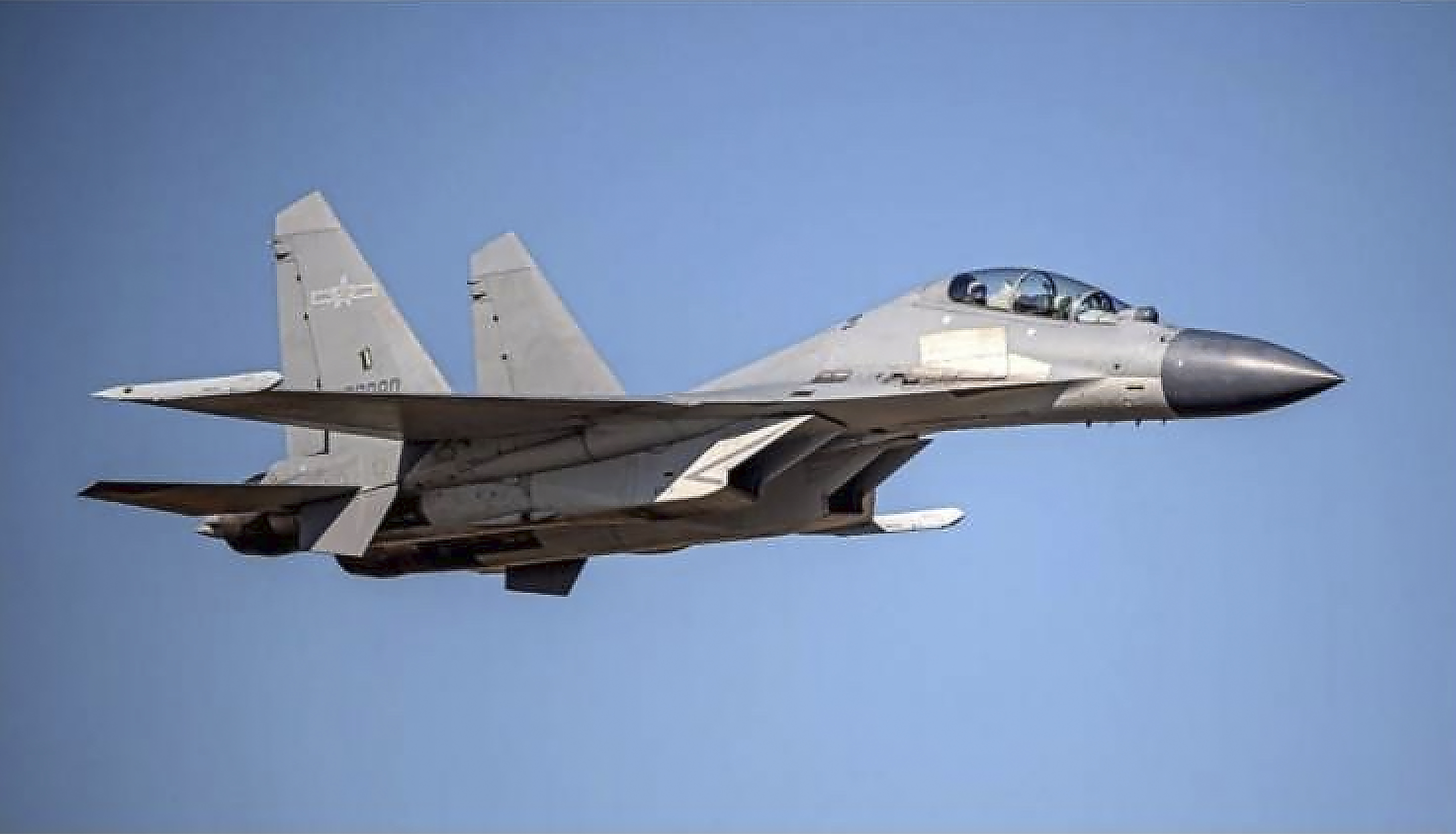 A photo of a Chinese PLA J-16 fighter jet in the sky.
