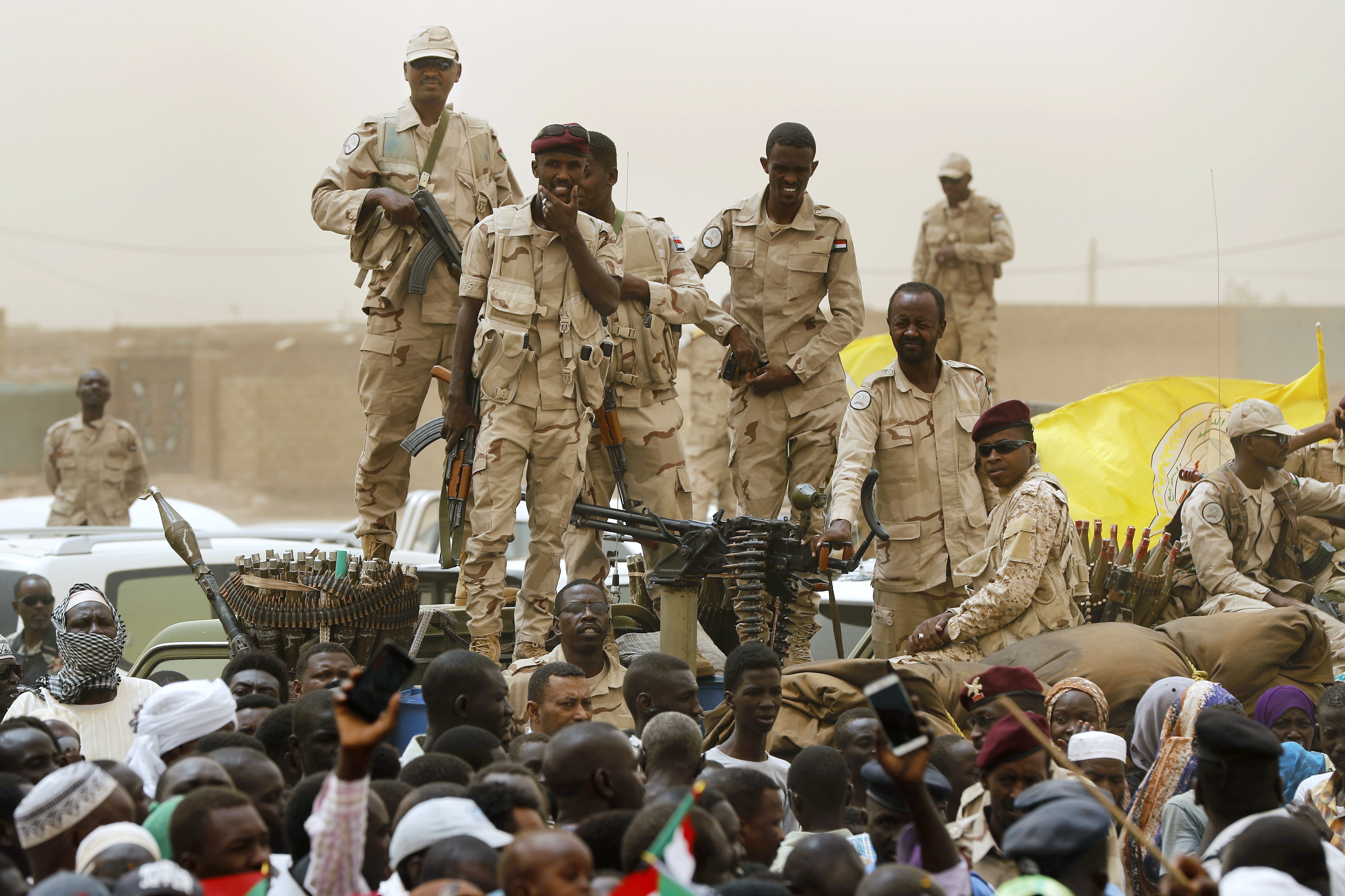 Sudanese soldiers from the Rapid Support Forces stand on a vehicle during a military-backed rally, in Mayo district, south of Khartoum, Sudan
