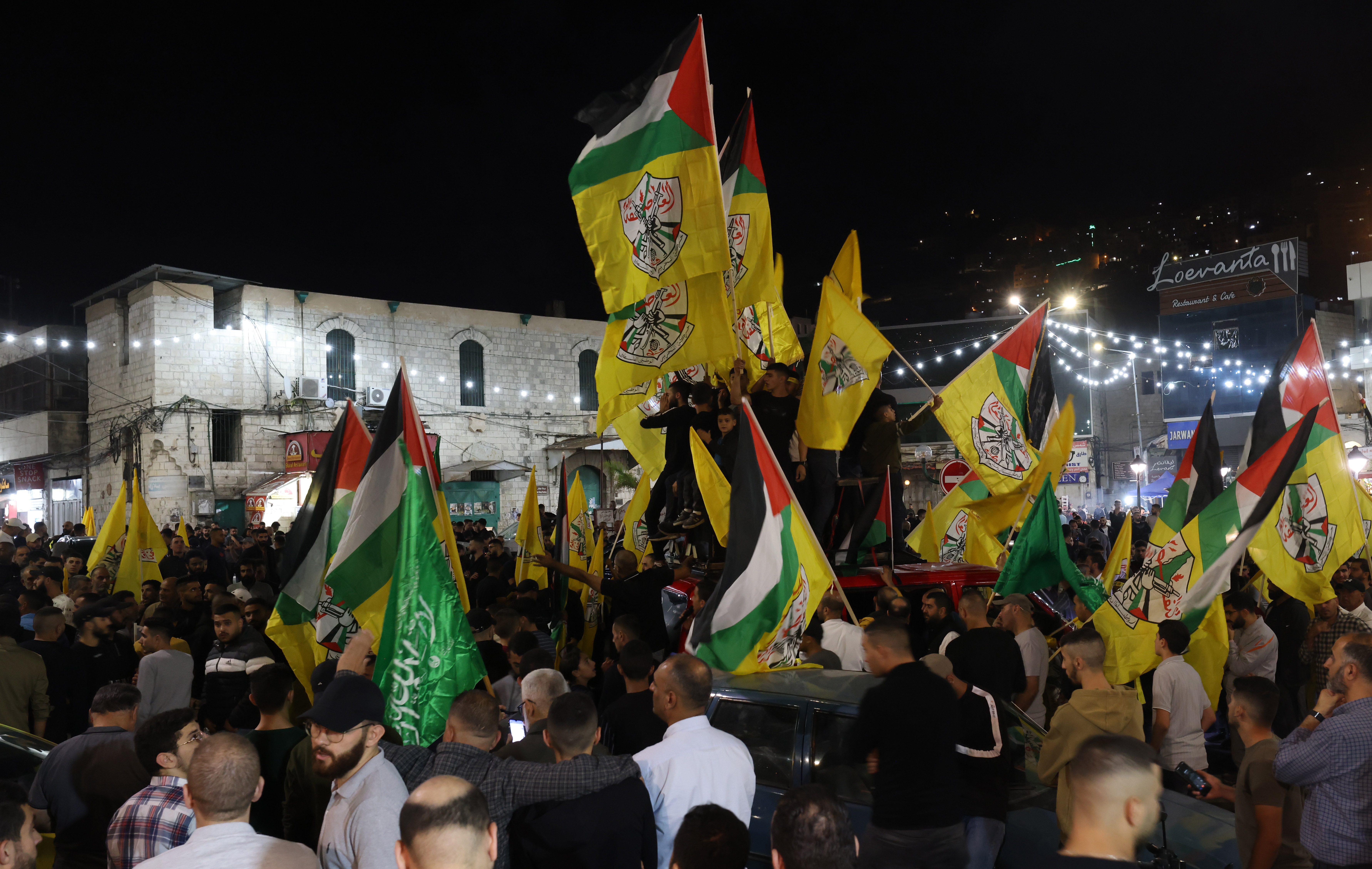 Palestinians protest against an Israeli strike on a hospital in Gaza, in the West Bank city of Nablus